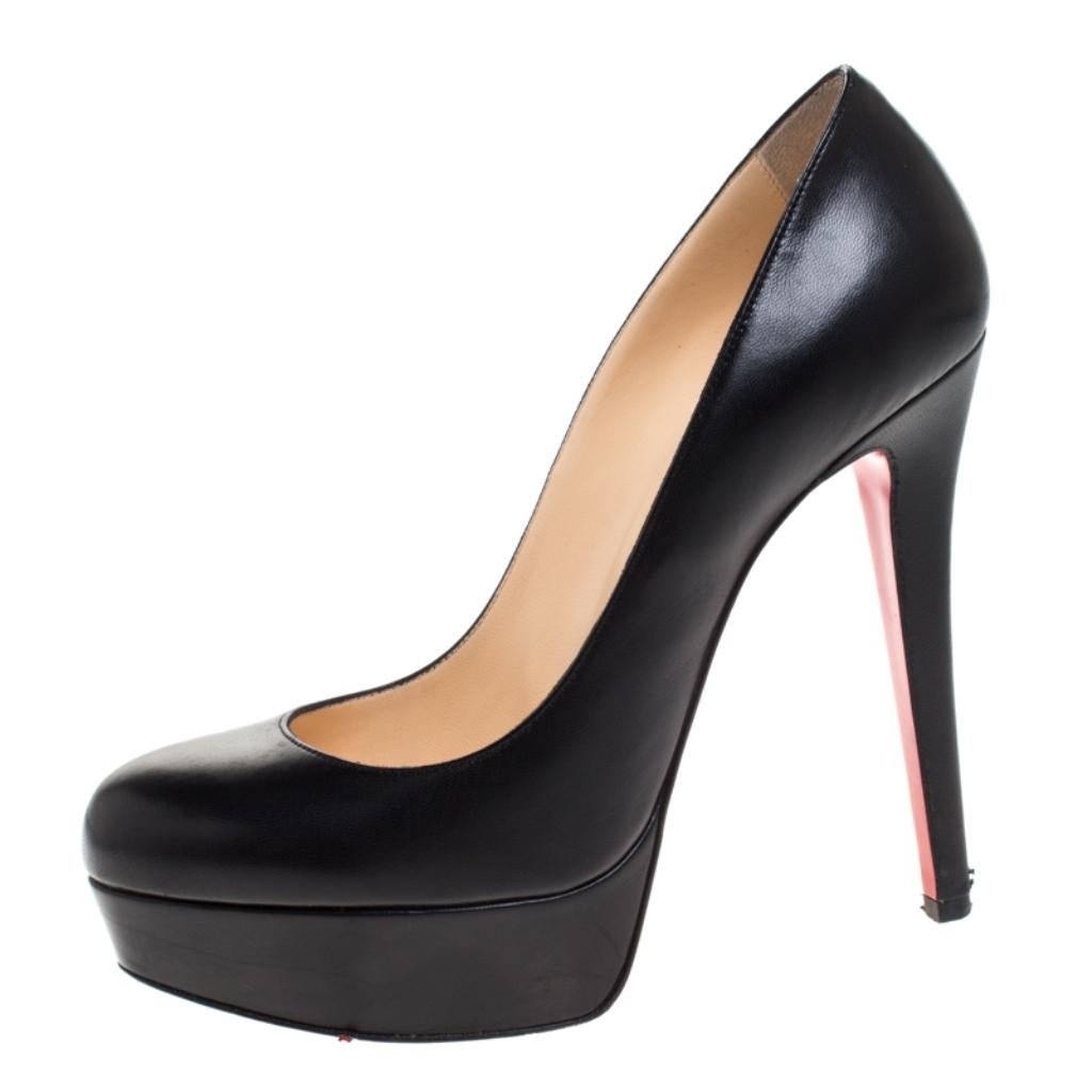 A classic to add to one's shoe collection is this pair. These Christian Louboutin beauties are covered in leather and styled with platforms, 12.5 cm heels, and the signature red soles. Add these pumps to your closet today and flaunt them with