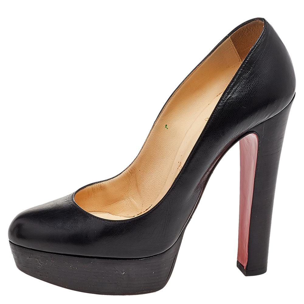 Every shoe collection needs a pair of ageless pumps as enchanting as this one from Christian Louboutin. These beauties are covered in black leather and finished with platforms and the iconic red soles. The 13.5 cm heels will ensure you'll shine