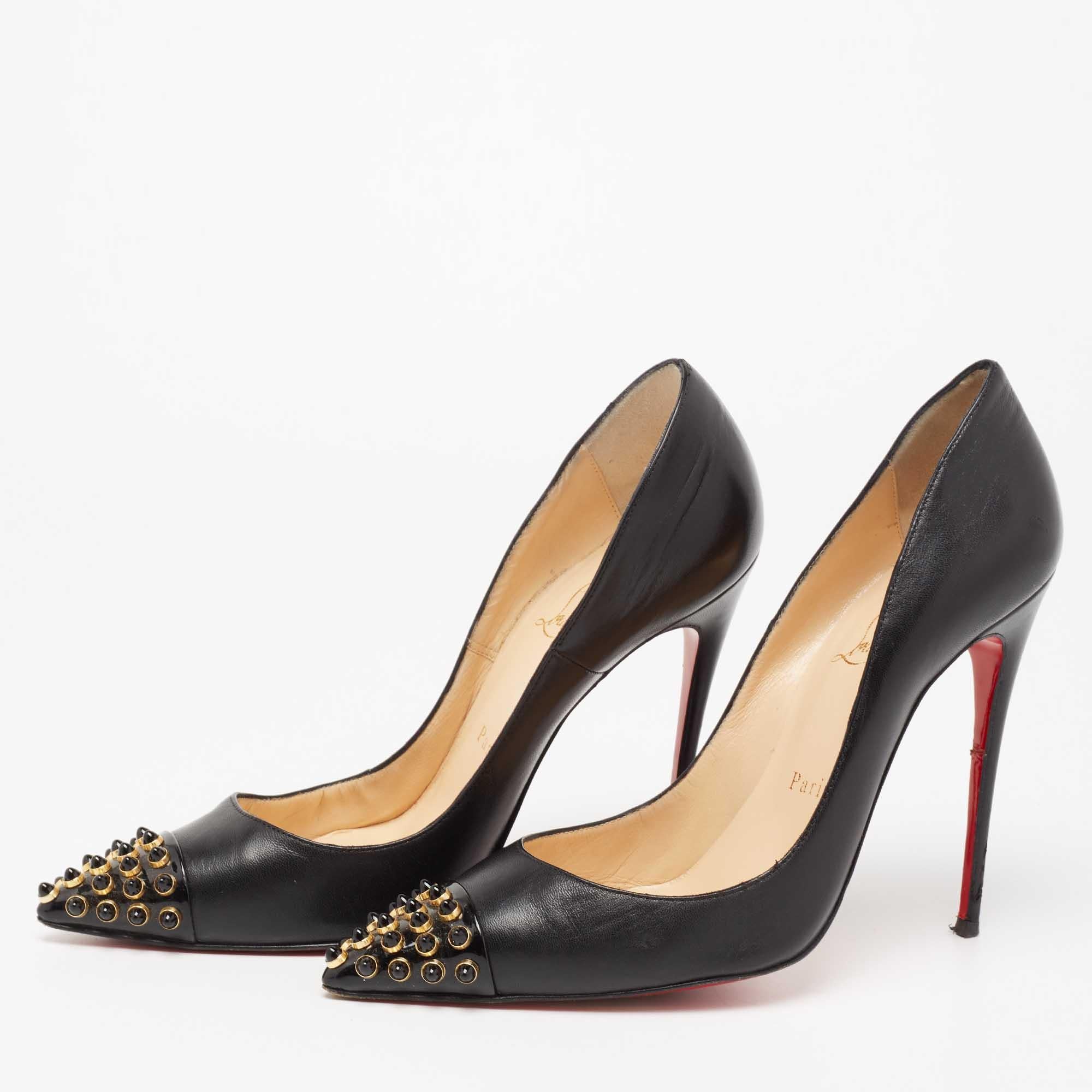 Take every step with elegance and style in these Cabo pumps from the House of Christian Louboutin. They are crafted meticulously using black leather, with embellishments on their pointed toes. They showcase slim heels and a slip-on feature. These