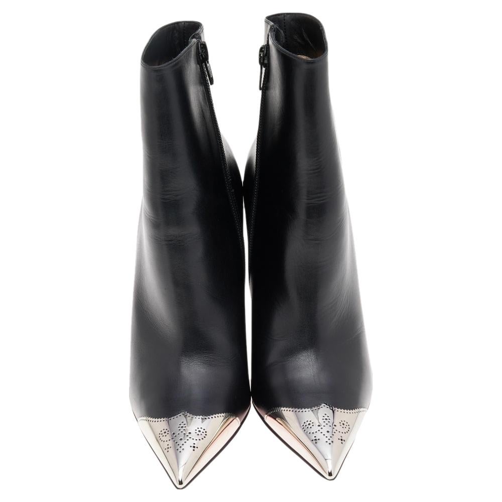 These boots from the house of Christian Louboutin are urban and sophisticated! Crafted in leather, they feature catchy Calamijane metal cap pointed toes along with side zip fastenings. The insoles are leather lined and carry brand labeling. This