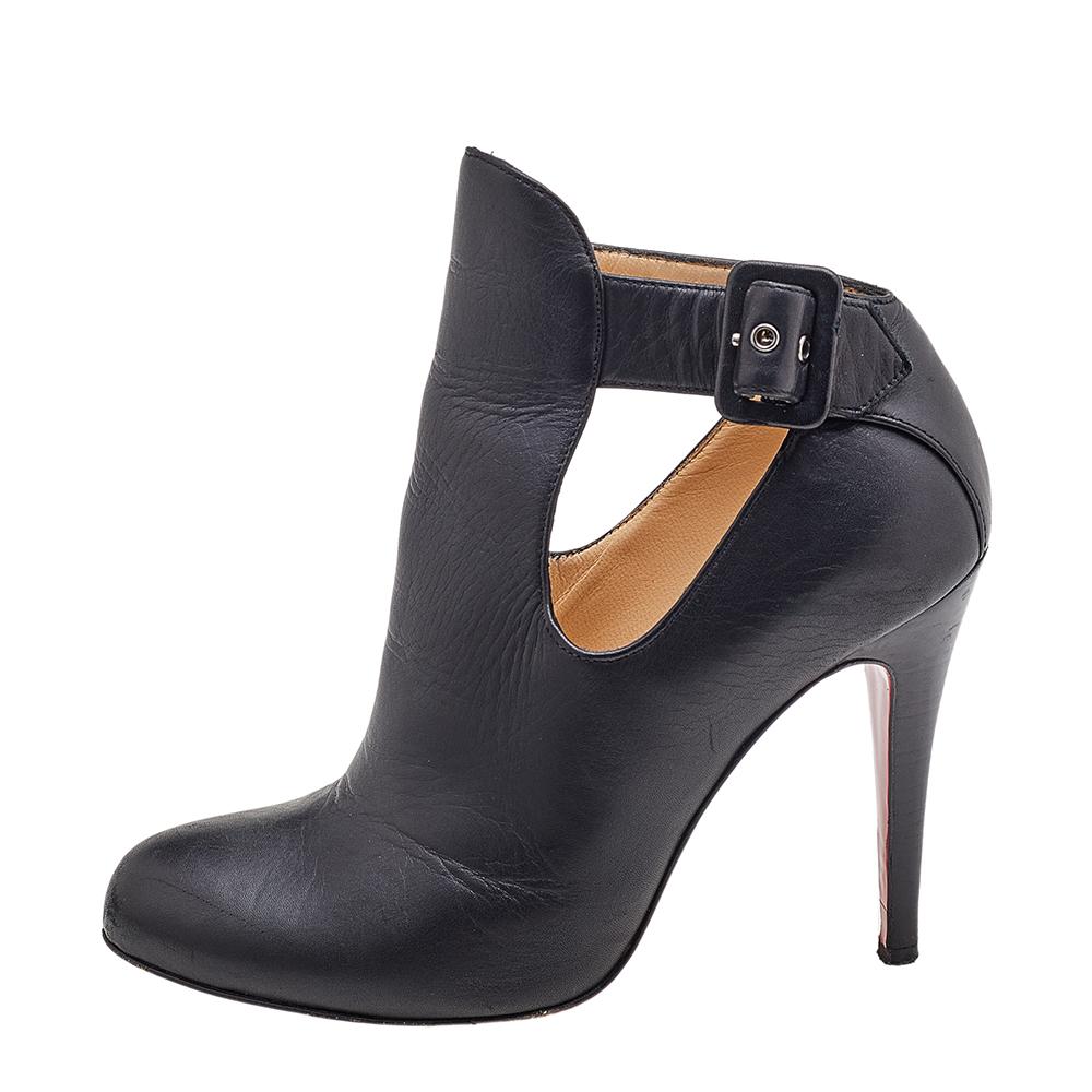 Designed by Christian Louboutin, these booties will infuse glamour and elegance into your style. They are stunningly crafted using black leather and feature cut-out details, round-toes, and an ankle length. They are complete with buckled closures,