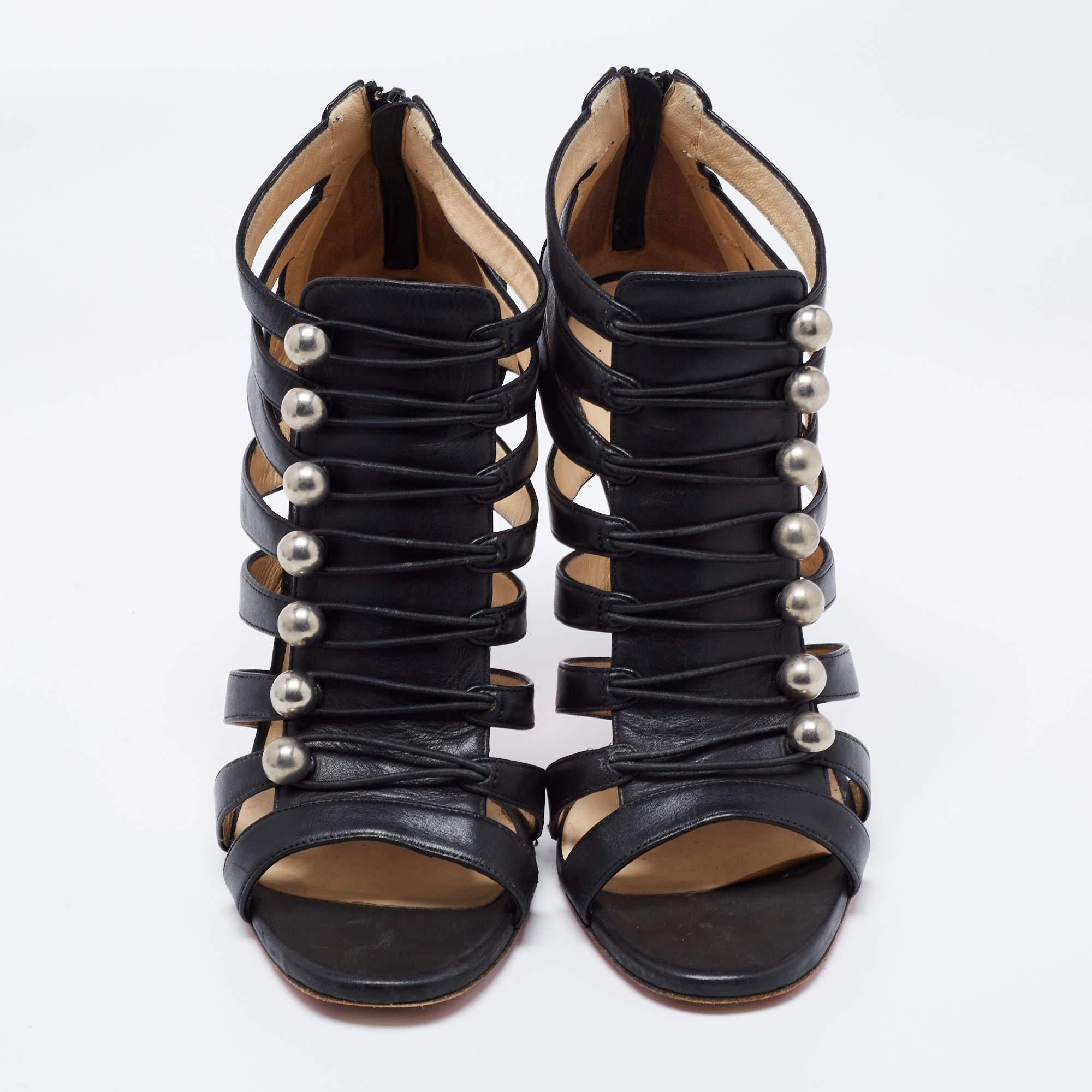 Create an unforgettable statement edit for a party even with the simplest of outfits with these Christian Louboutin caged sandals. The stylish and eye-catching black leather and silver-tone studs are stationed together on this stunning pair which is