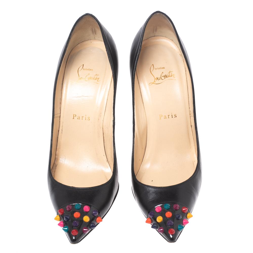 Be ready for praises and admirable gasps from your audience when you walk in these pumps from Christian Louboutin. Crafted from black leather, they carry pointed toes and spikes decorated on the contrasting cap toes. The pair is complete with 10 cm