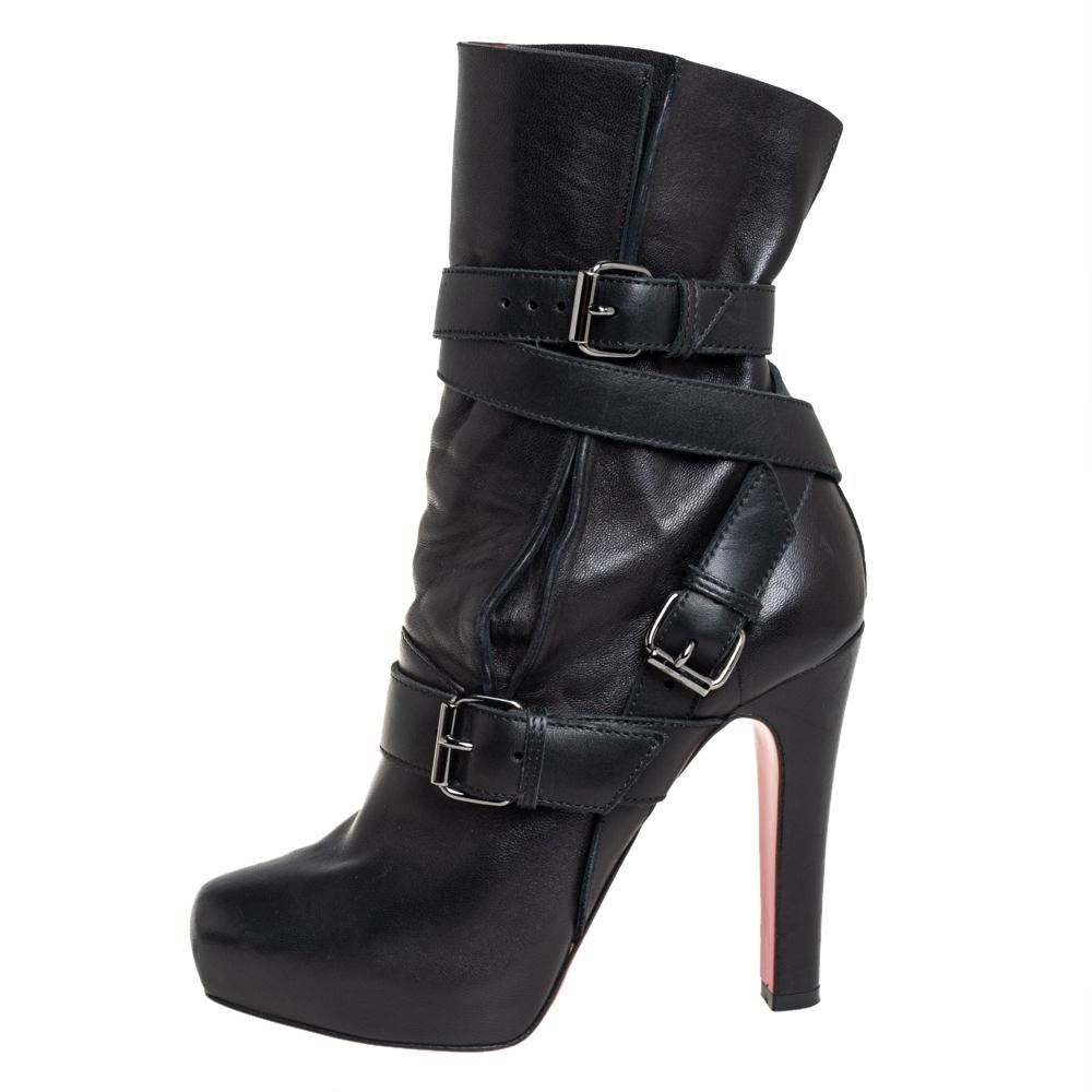 These rock-chic boots by Christian Louboutin is just the element that was missing from your closet all this while. Crafted from black leather, they feature a strappy design accented with buckles. Featuring almond toes, these boots are elevated on 12