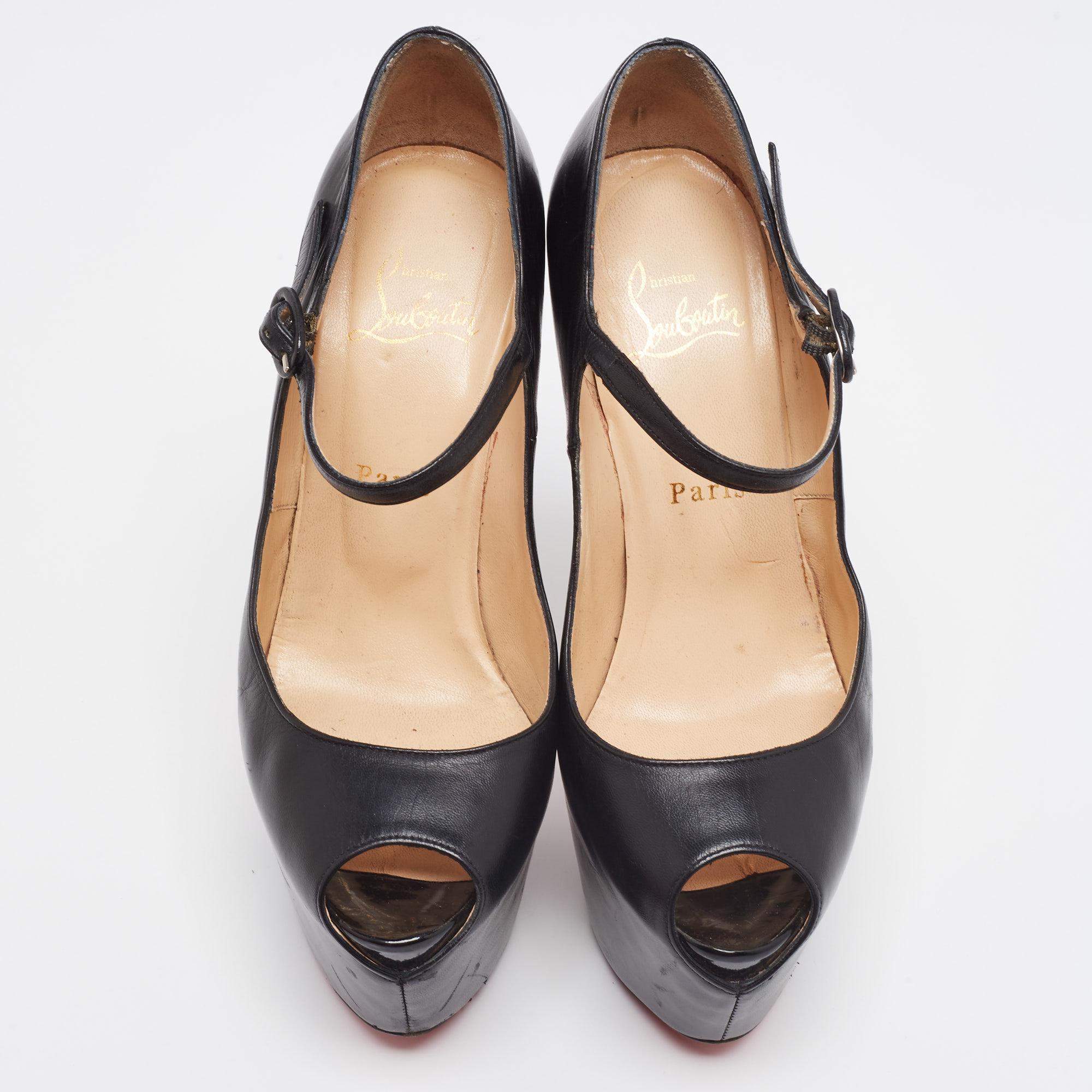 Louboutins are designed to lift one's attitude and outfit. So, let this pair lift yours as well by owning them today. Crafted from black leather, these pumps carry a Mary Jane style with buckle straps and towering 15.5 cm heels supported by sturdy