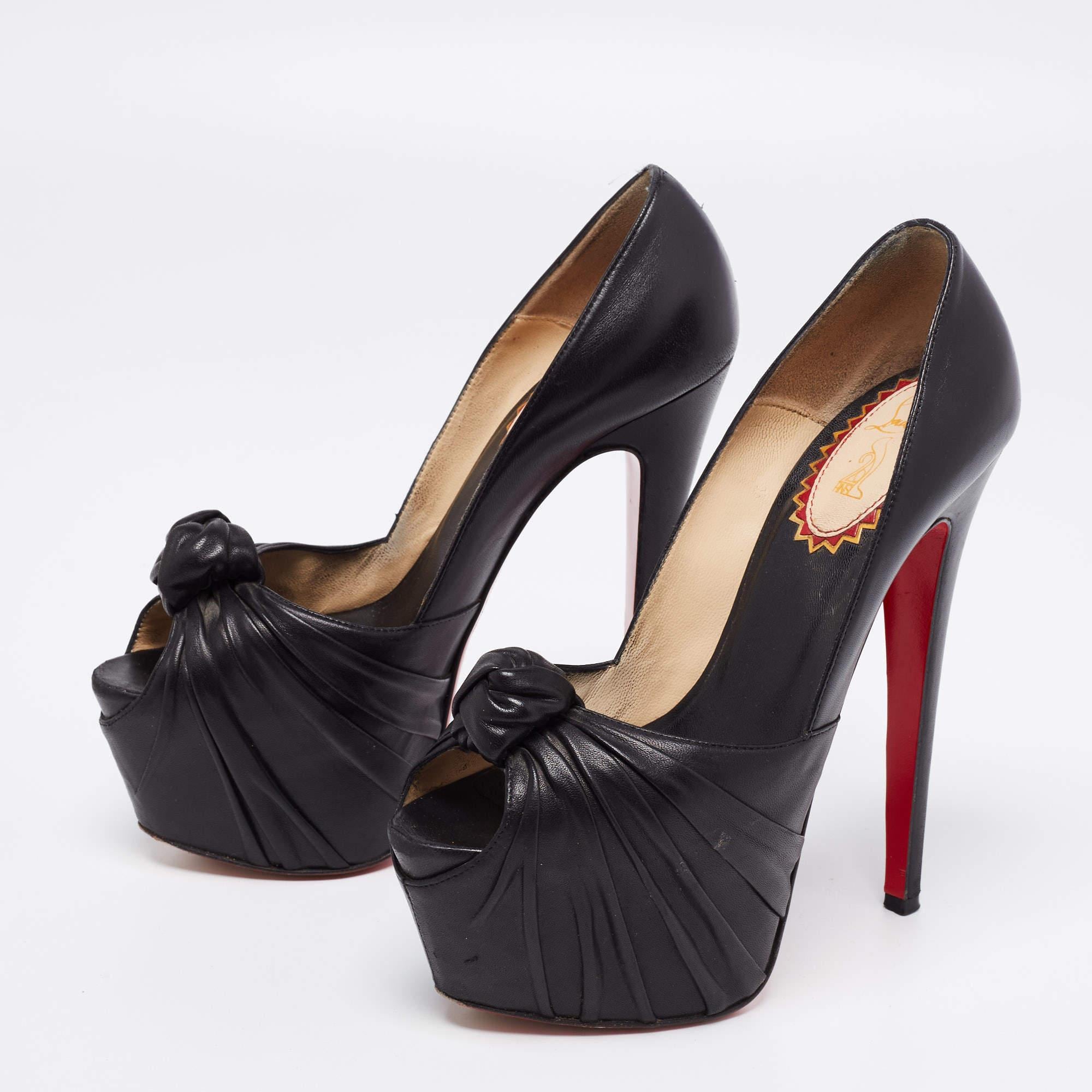 Set on towering heels and crafted with skilled perfection, these Lady Gres pumps from Christian Louboutin are here to elevate your style and take it a few notches higher! They are created using black leather and feature peep-toes, thick platforms,