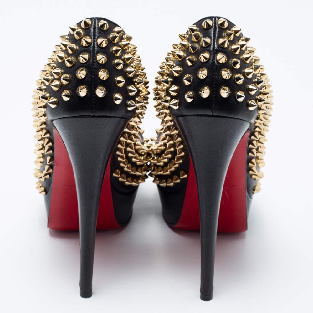 The House of Christian Louboutin brings an element of class to your closet with these stunning Lady Peep pumps. They are created using black leather and showcase peep toes, Spike accents, platforms, and tall heels. Make a fashion statement by