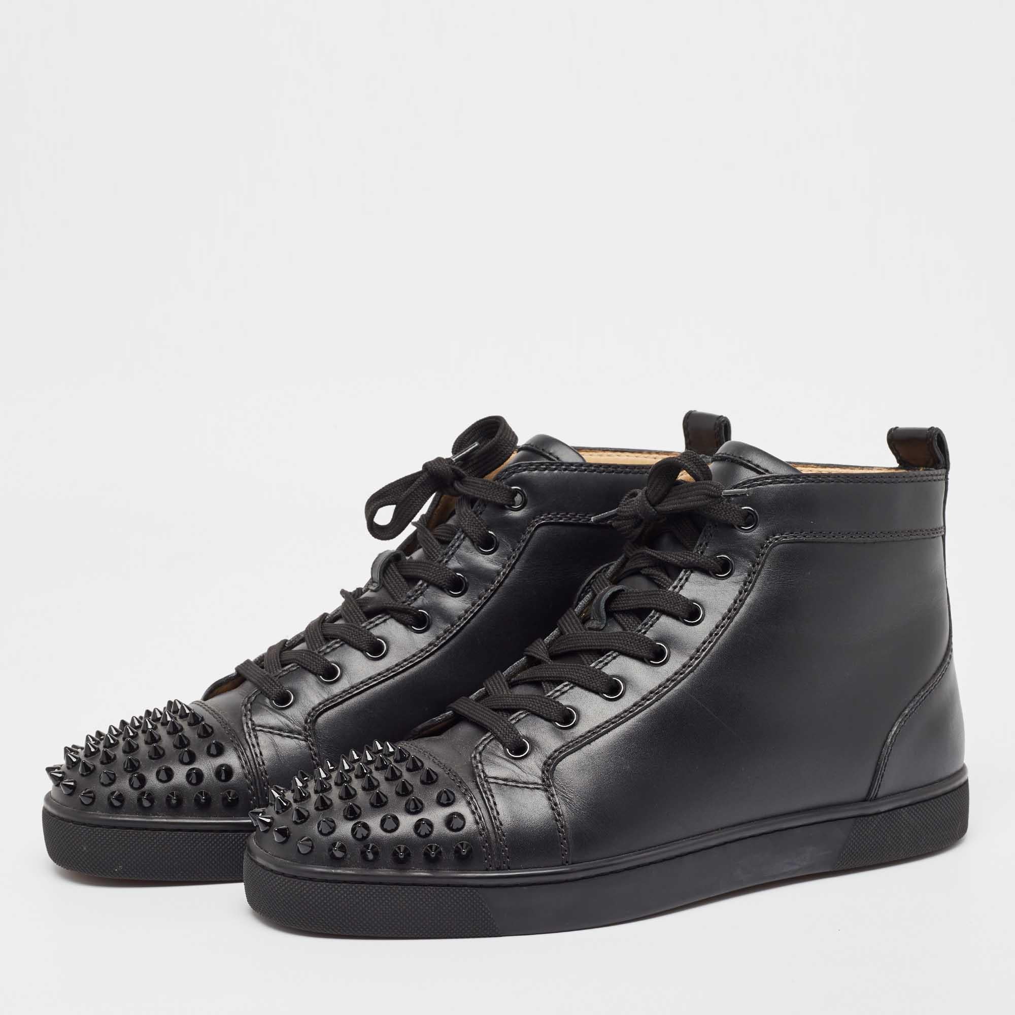 A stunning update on a signature design, these Christian Louboutin sneakers feature signature patterns. The pair has round toes, lace-up vamps, and spikes that are hand-placed on the cap toes. The sneakers have a smooth exterior made from leather