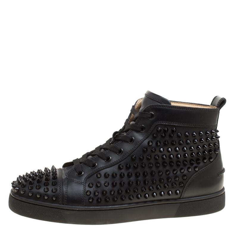 Fall in love with casual wear every time you step out in these sneakers from Christian Louboutin. They've been crafted from black leather and styled as a high top with an exterior wonderfully lined with spikes. The sneakers carry round toes, lace-up