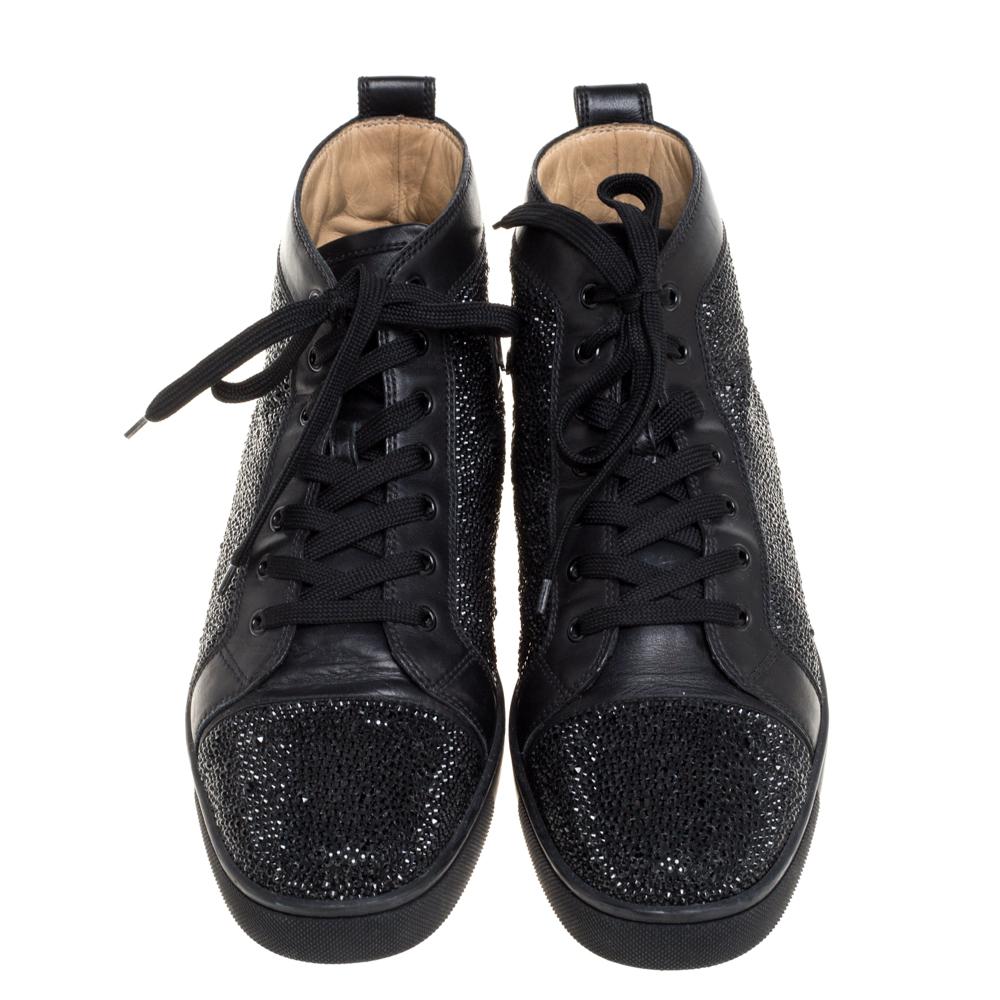 You'll leave your friends amazed every time you step out in these Louis Strass sneakers from Christian Louboutin! These sneakers are crafted from black leather and feature round toes and an embellished exterior. They flaunt lace-ups on the vamps and