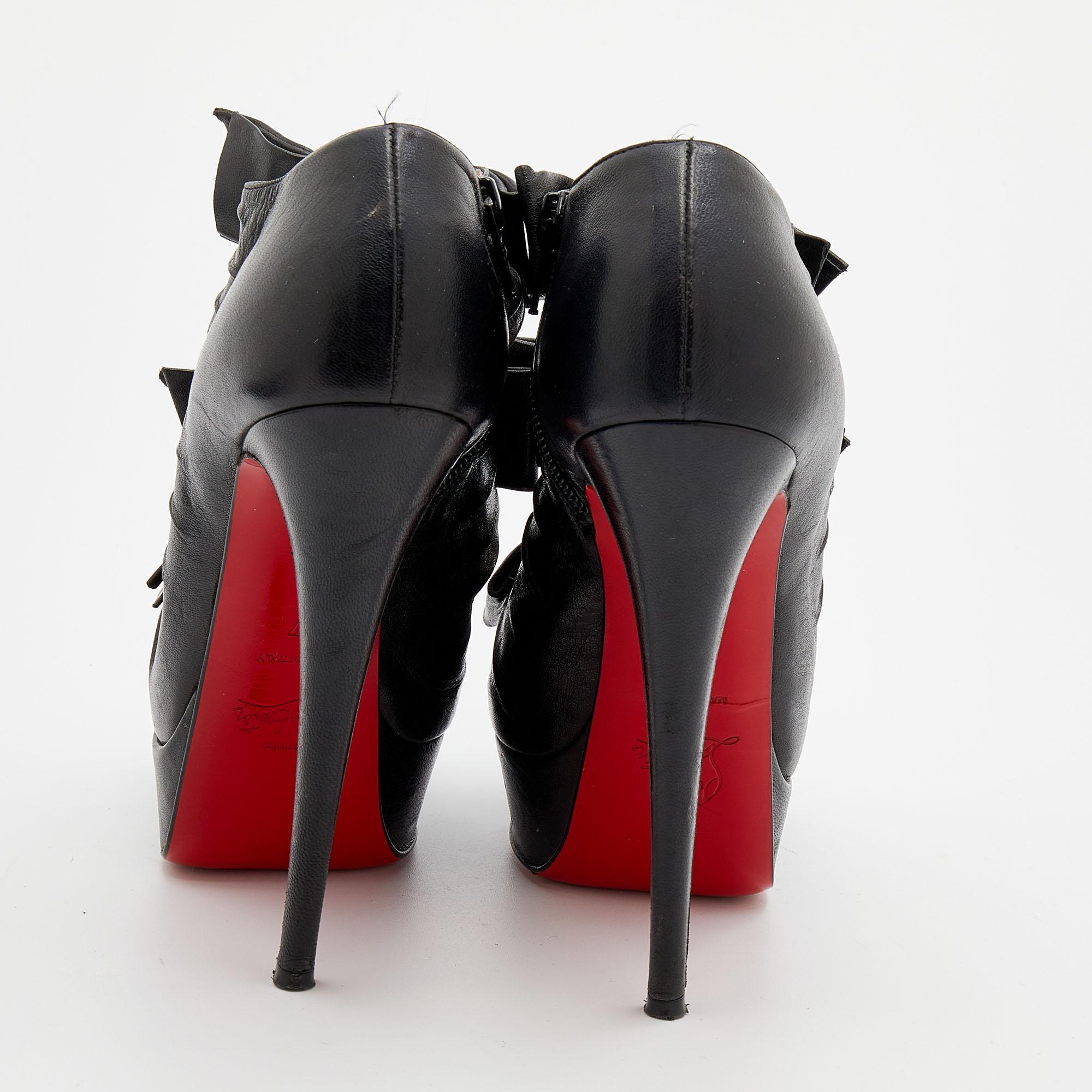 These peep-toe booties from Christian Louboutin are all about making a style statement. They are crafted using black leather with three knotted bow details on each upper. They have been incorporated with smooth insoles and towering 14.5 cm heels.