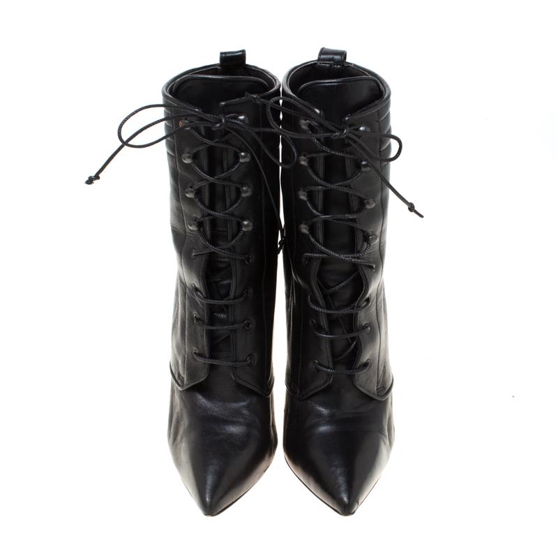 Impeccably crafted into a super-stylish silhouette, these Mado ankle boots from the house of Christian Louboutin will help you create a stunning style statement. They are made from leather and fashioned with pointed toes, lace-up vamps and 11 cm