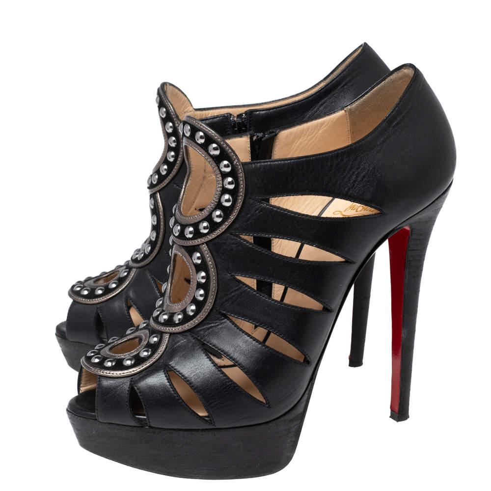 An exceptional flair and a chic appeal characterize these Maralla booties from Christian Louboutin. They are designed using black leather, which is enhanced with studded accents and cut-outs. They showcase slender heels and red soles. Elevate the