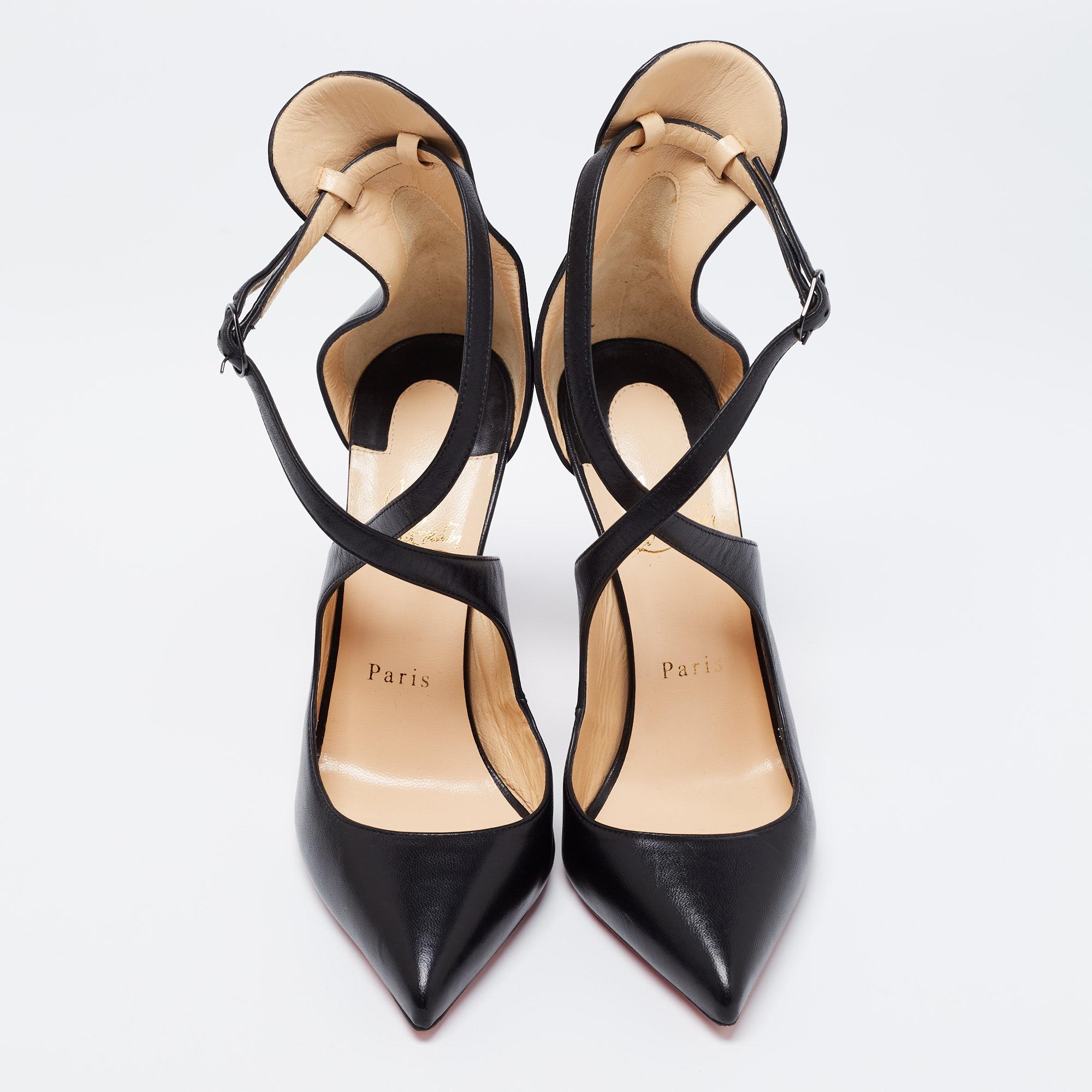 Skilfully crafted from black leather, these pointed-toe Christian Louboutin pumps come ready to give you a high-fashion experience. The rich pumps, with sharp cuts and cross straps with buckles, are balanced on 12.5 cm heels and finished with the