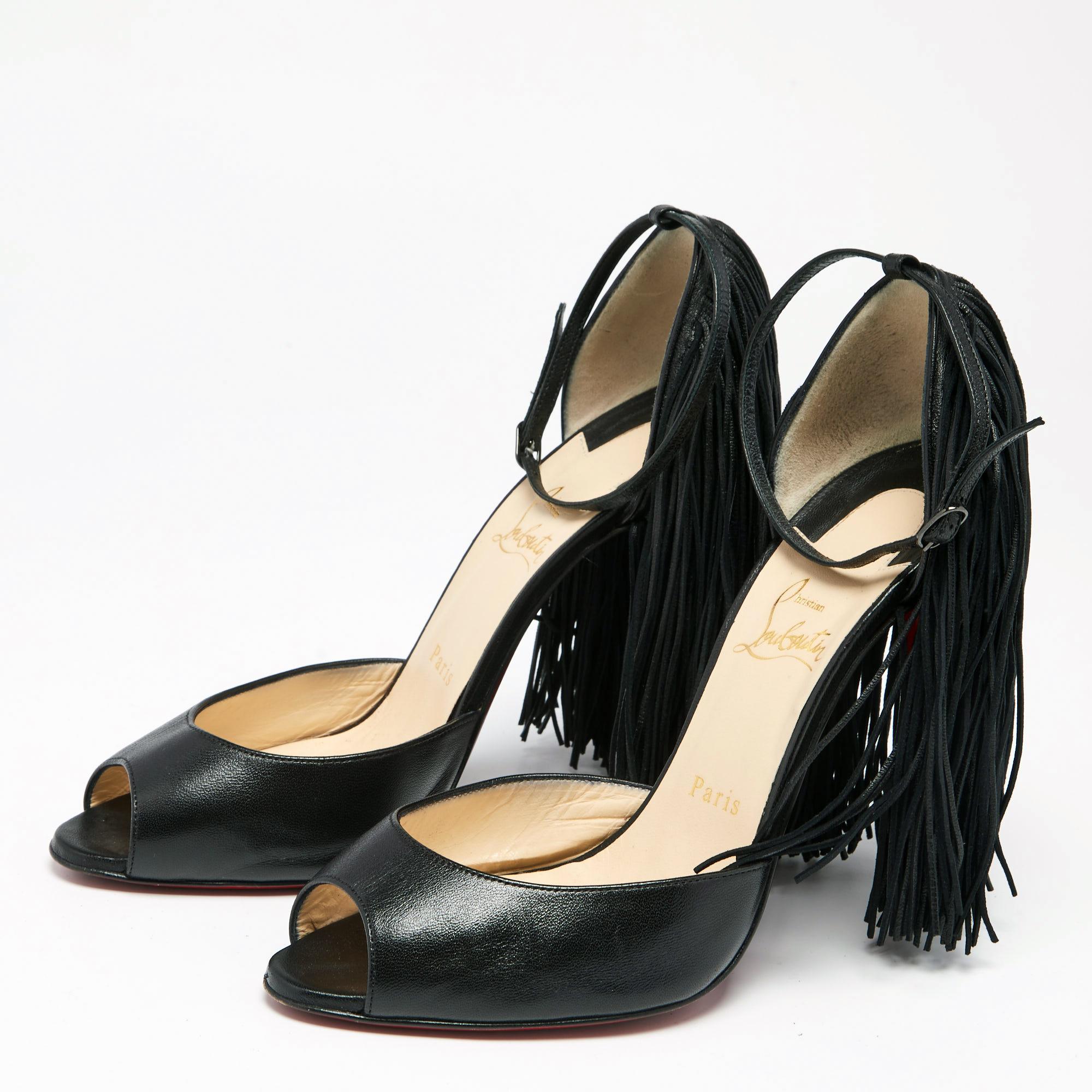 One of the most celebrated fashion houses, the Parisian label Christian Louboutin is known for its brilliant craftsmanship in shoemaking. These Otrot sandals are highlighted with playful fringes on the counters that veil the 12.5 cm high heels. They