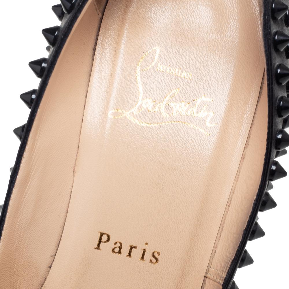 Dazzle everyone with these Louboutins by owning them today. Crafted from leather, these black pumps carry a mesmerizing shape with pointed toes, spike embellishments on the exterior, and high heels. Complete with the signature red soles, this pair