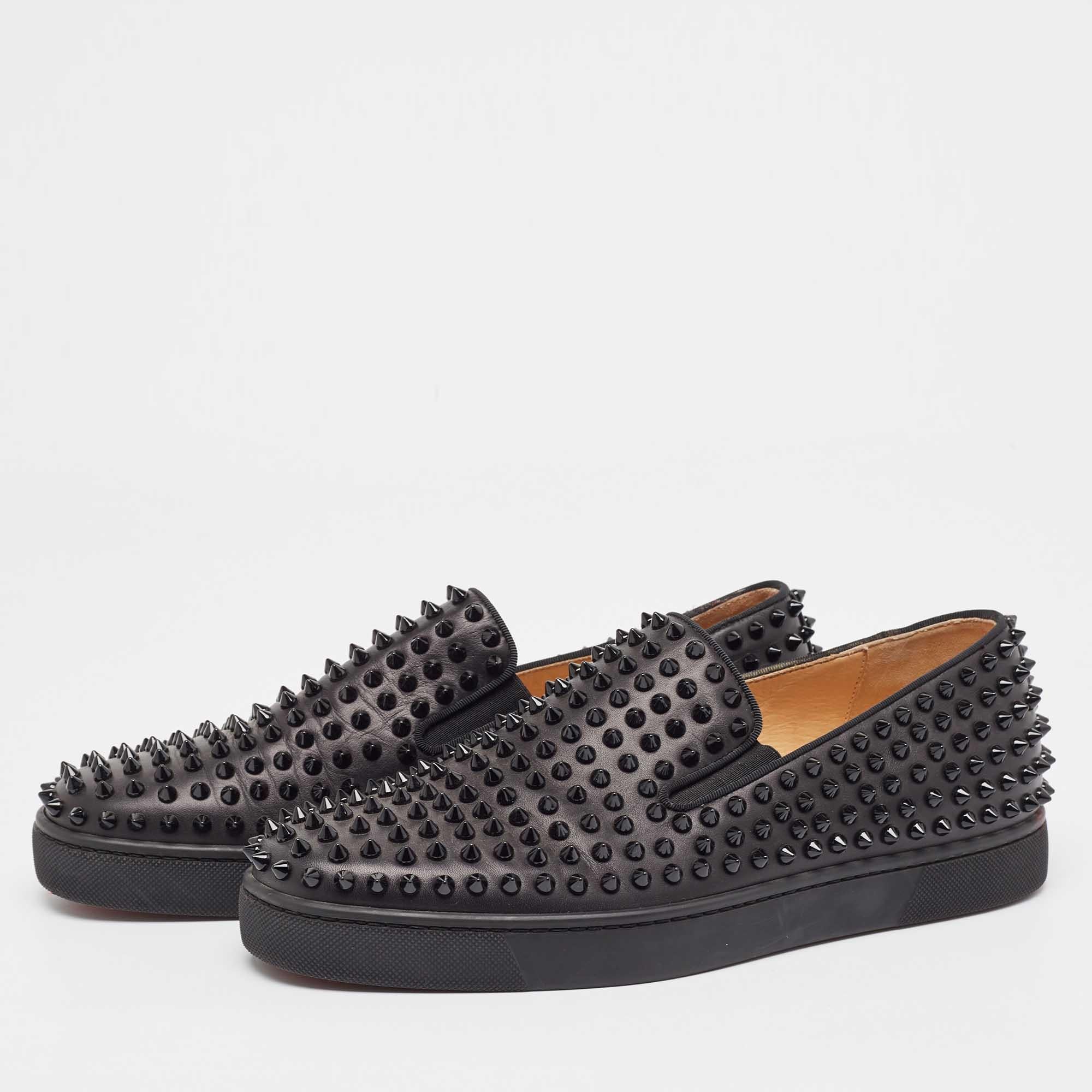 Deliver a statement look every time you step out in these sneakers from Christian Louboutin. They've been crafted from leather and styled with spikes. The black sneakers carry round toes, leather insoles, and signature red soles.
