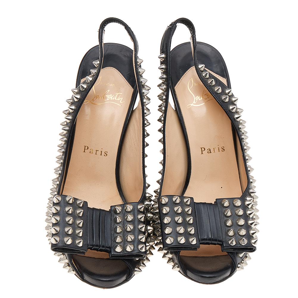 Amp up your evenings with these Clou Noeud sandals by Christian Louboutin. These slingbacks feature a studded leather exterior, 11.5 cm high stiletto heels, and studded bows at the toes. The insoles are leather padded with brand name logos.

