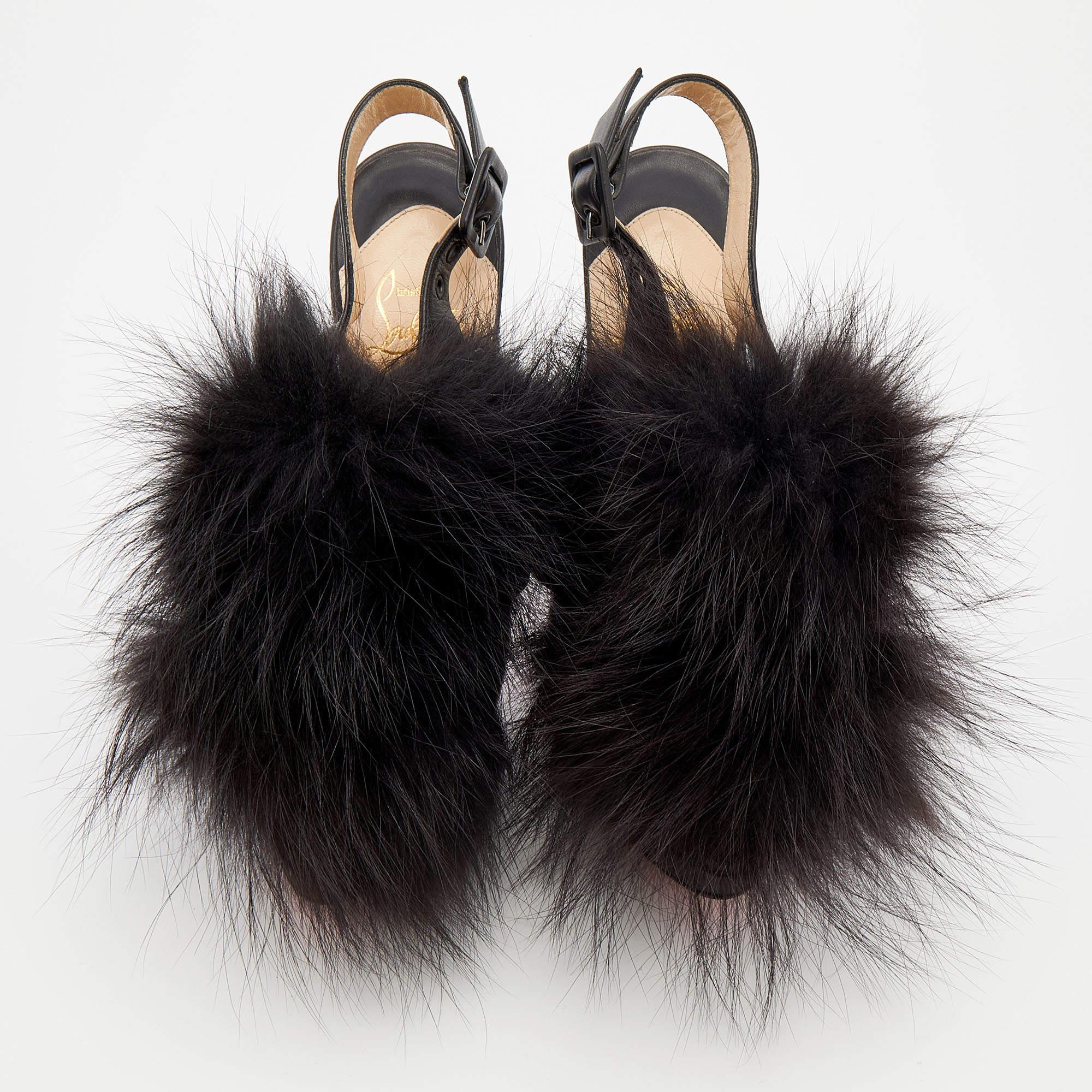 These splendid sandals from Christian Louboutin have an ultra-modern feel with an artistic edge. The leather exterior adorned with extravagant fur trims on the front is visually appealing and the towering 15 cm heels offer loads of glamour. Buckles