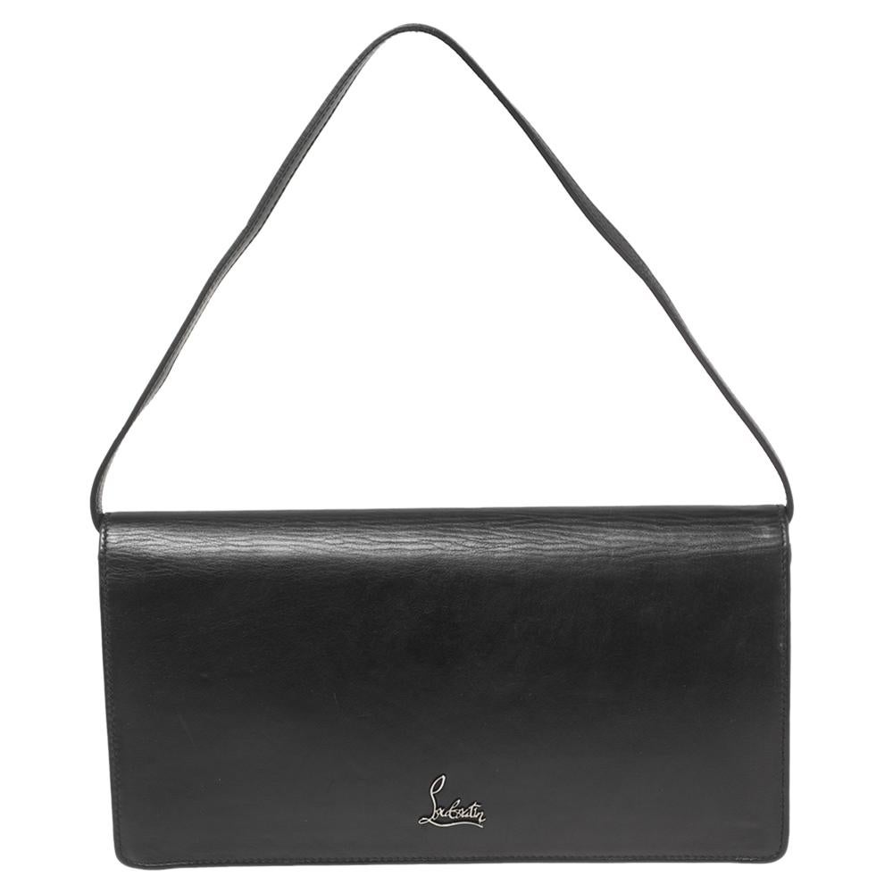 This clutch from the House of Christian Louboutin is absolutely stylish and functional. It is created using black leather on the exterior, with studded accents placed on the front. It accommodates a fabric-lined interior and displays silver-tone