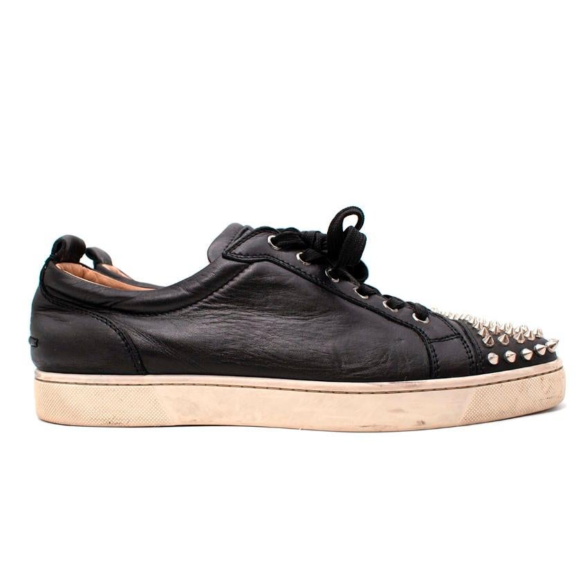 Christian Louboutin Black Leather Studded Toe Sneakers
 

 - Black smooth leather low-top sneakers
 - Silver-tone stud embellishment to the round toe
 - Set on a white rubber sole
 - Tonal lace-up closure
 

 Materials:
 Leather
 Rubber
 

 Made in