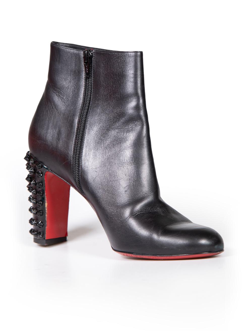 CONDITION is Very good. Minimal wear to boot is evident. Minimal wear to uppers with minor creasing. Missing spike on right heel and peeling of the outsole on the left heel on this used Christian Louboutin designer resale item. Comes with original