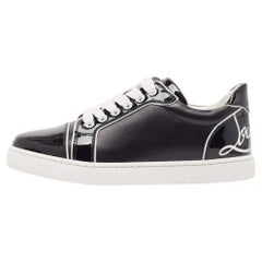 Christian Louboutin Schwarze Low Top-Turnschuhe aus Lack und Leder Größe 36