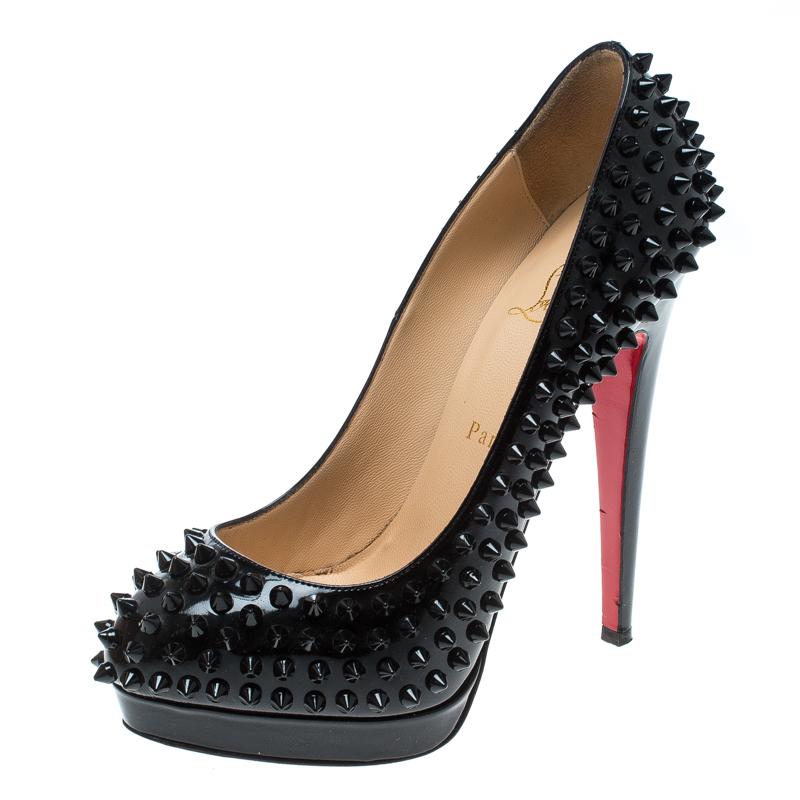 These spiked patent leather pumps from Christian Louboutin are supposed to be inspired by punk style. The stiletto heel and closed toe design keep to conventional style. The black spikes all over the body and red soles add to the chic look of the