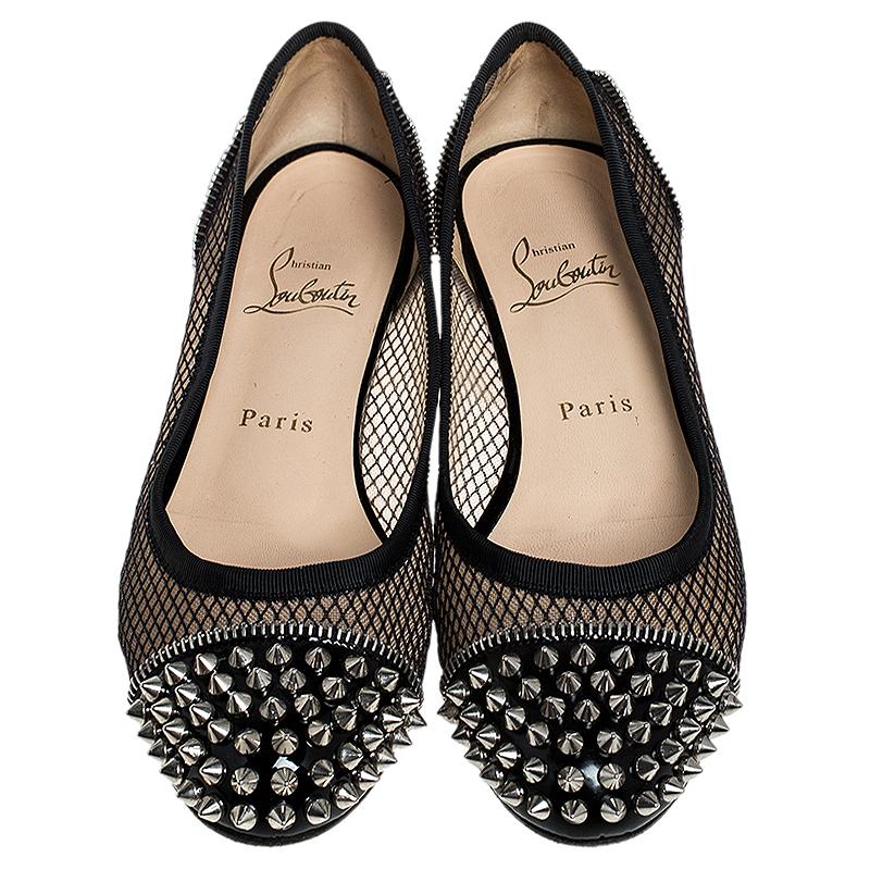 Appealing and very stylish, these ballet flats from Christian Louboutin are a must-buy! The black flats have a mesh design with leather cap toes featuring spikes. Comfortable leather-lined insoles and the signature red-lacquered soles complete this