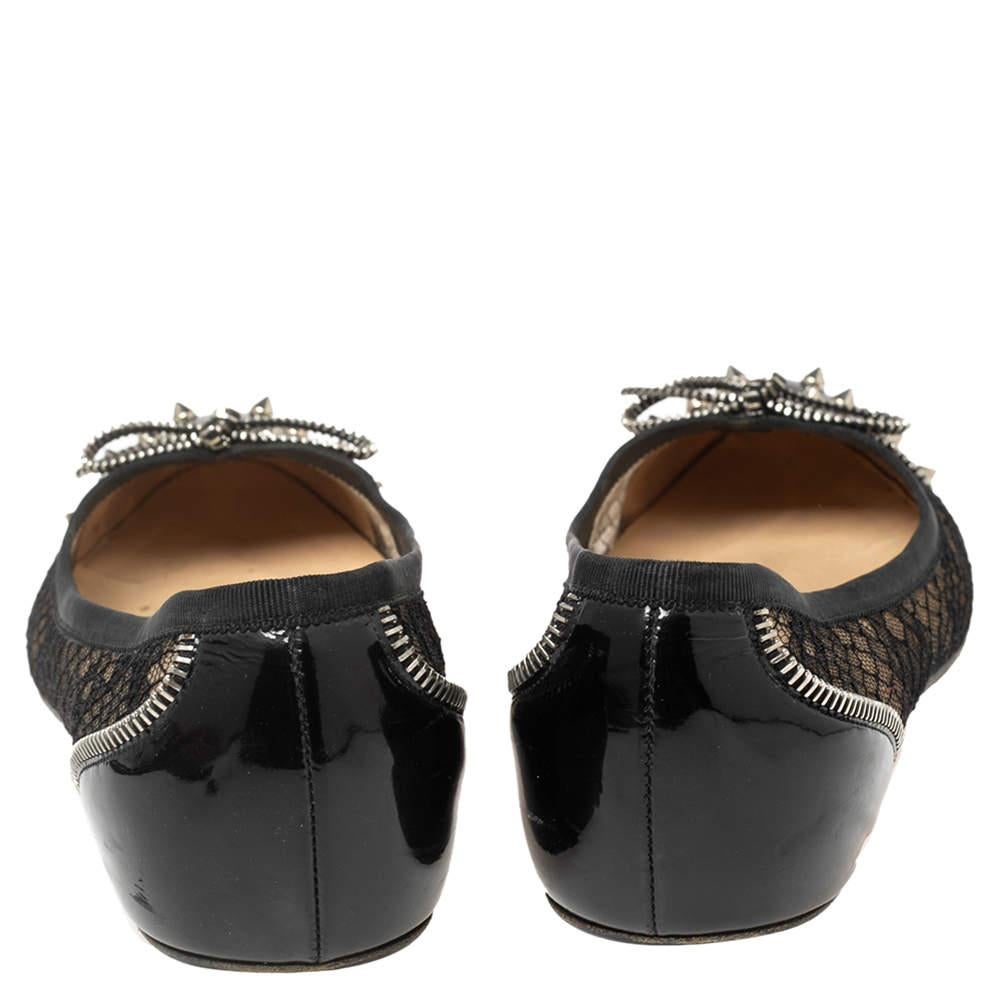 Appealing and very stylish, these ballet flats from Christian Louboutin are a must-buy! The black flats have a mesh design with patent leather cap toes featuring spikes. Comfortable leather-lined insoles and the signature red-lacquered soles