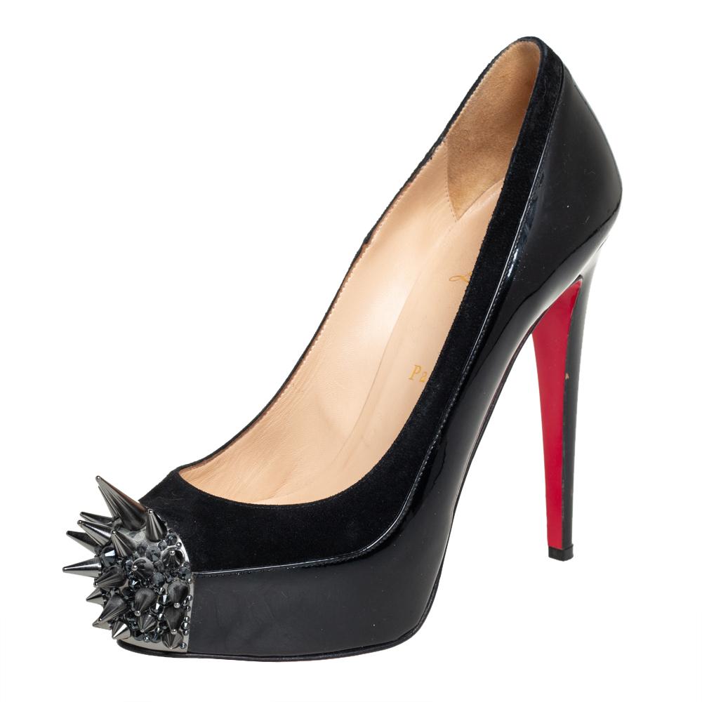 Jazz up your everyday attire with this pair of Asteroid pumps designed by Christian Louboutin. Crafted from patent leather and suede, these black ones are styled with platforms, high heels, and metal spikes on the toes. This pair of beauties has a