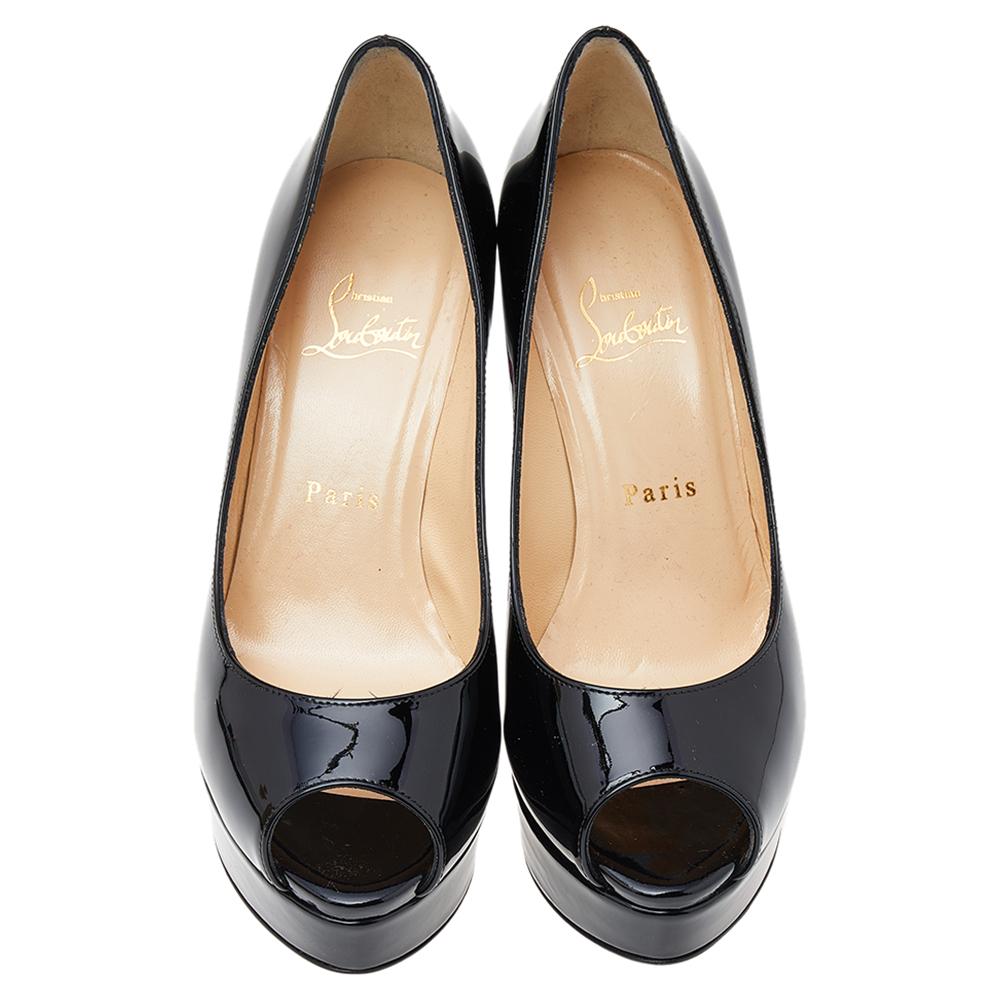 Strike a bold finish to your party outfit wearing these stunning Christian Louboutin Fetish pumps. Crafted from black patent leather, they feature a lovely peep-toe silhouette. The leather-lined insoles carry brand labeling and this pair is elevated