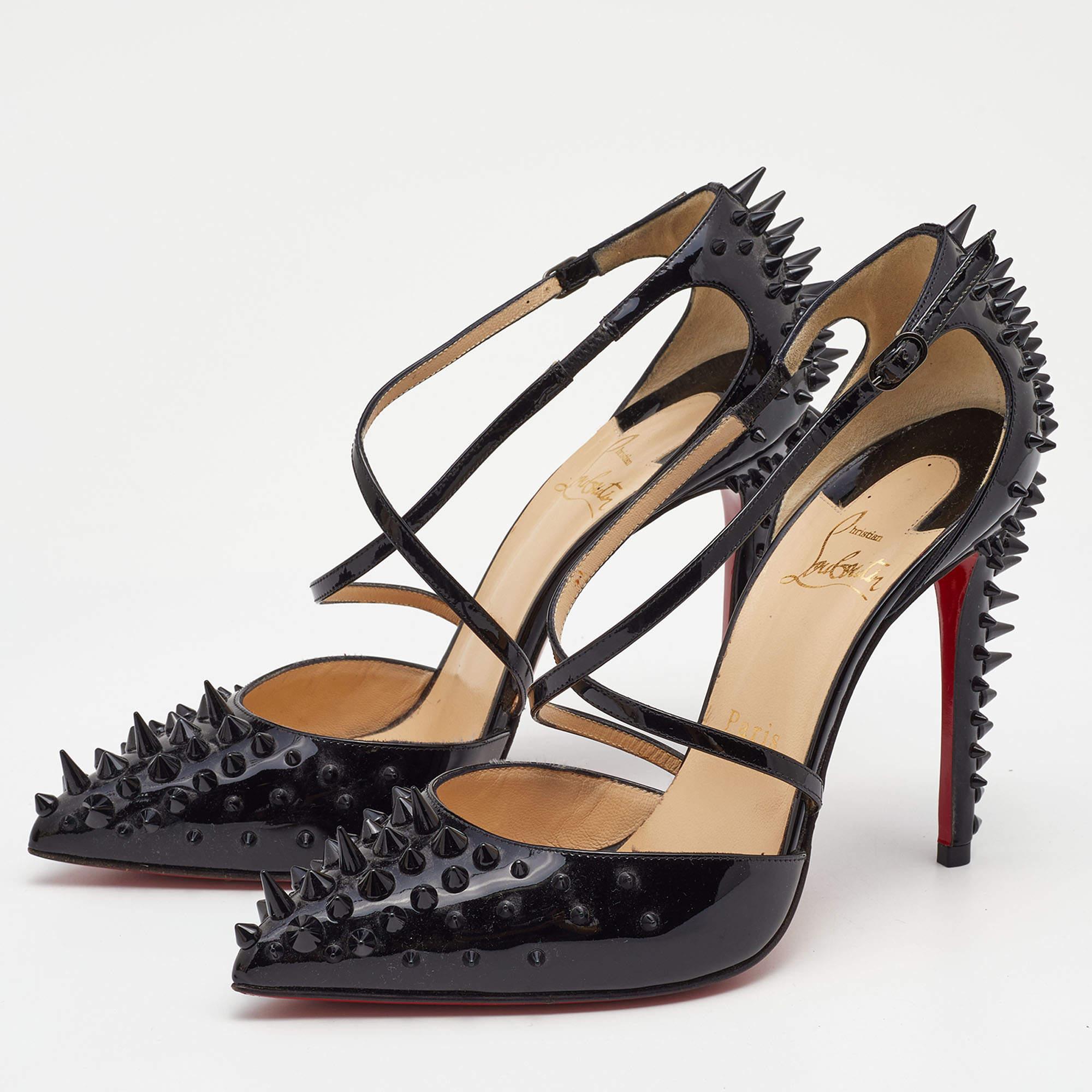 Rock these Christian Louboutin spike pumps at the next party! They have been crafted from patent leather into a criss-cross, ankle strap design and come with comfortable insoles. Gorgeously studded with unique spikes, you can team these bold 11.5 cm