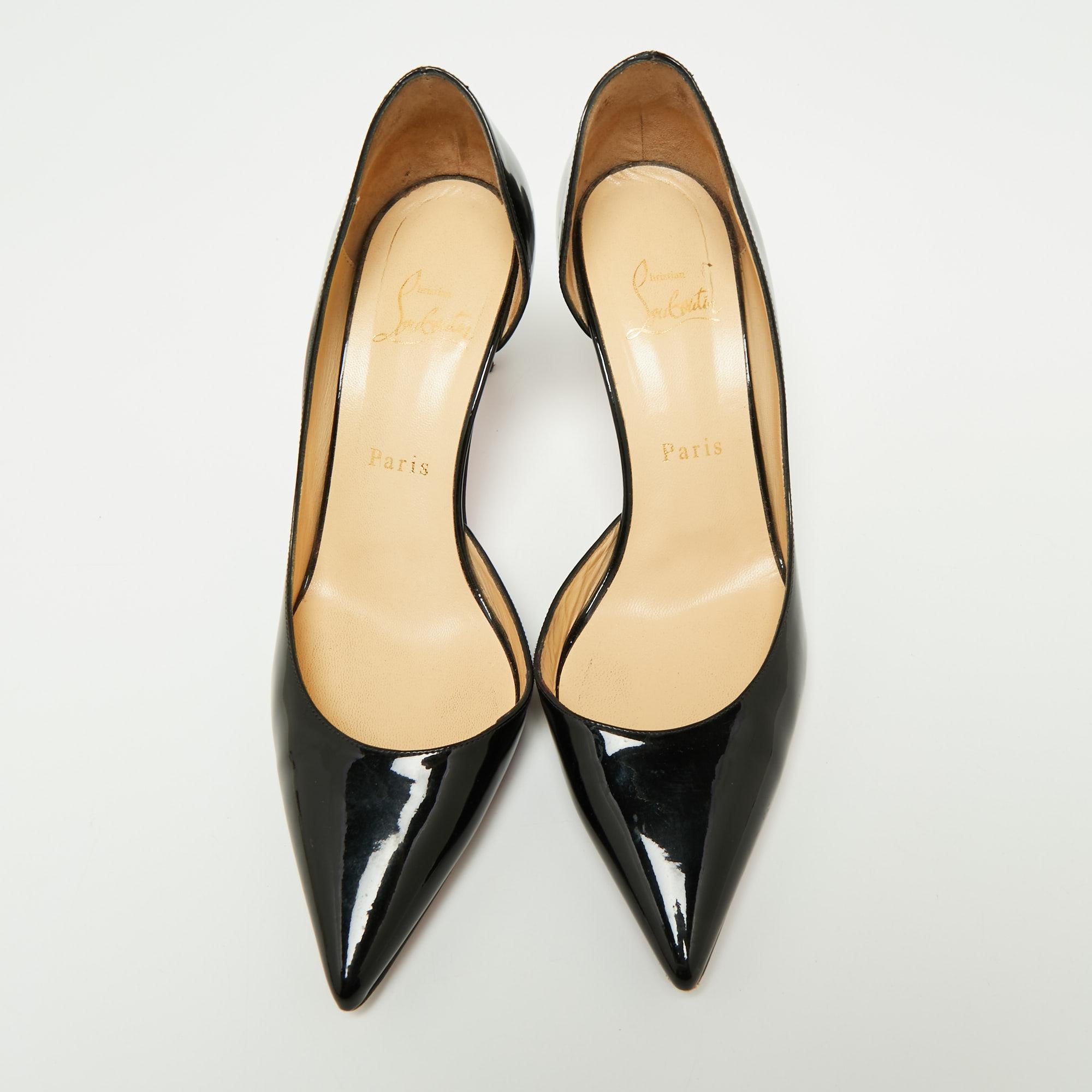 Skilfully crafted from patent leather in a D'orsay style with pointed toes, these Christian Louboutin pumps come ready to give you a high-fashion experience. The rich black pumps, with sharp-cut toplines, are balanced on 7 cm heels and finished with