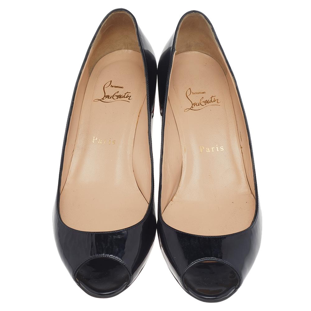 You'll love the striking style carried by these black patent leather pumps from Christian Louboutin. They flaunt peep toes, 5 cm kitten heels, and the signature red soles.

