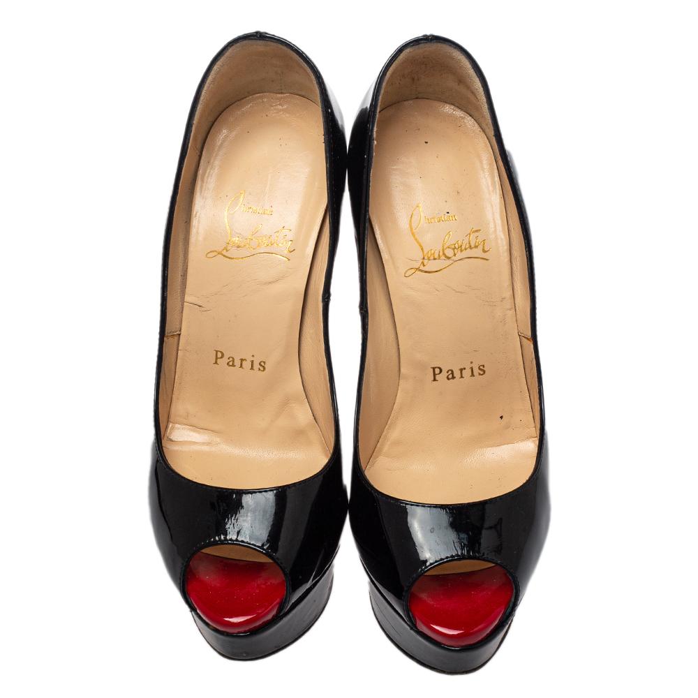 Stand out from the crowd with this gorgeous pair of Louboutins that exude high fashion with class! Crafted from patent leather, this is a creation from their Lady Peep collection. They feature a classic black shade with peep toes and a glossy
