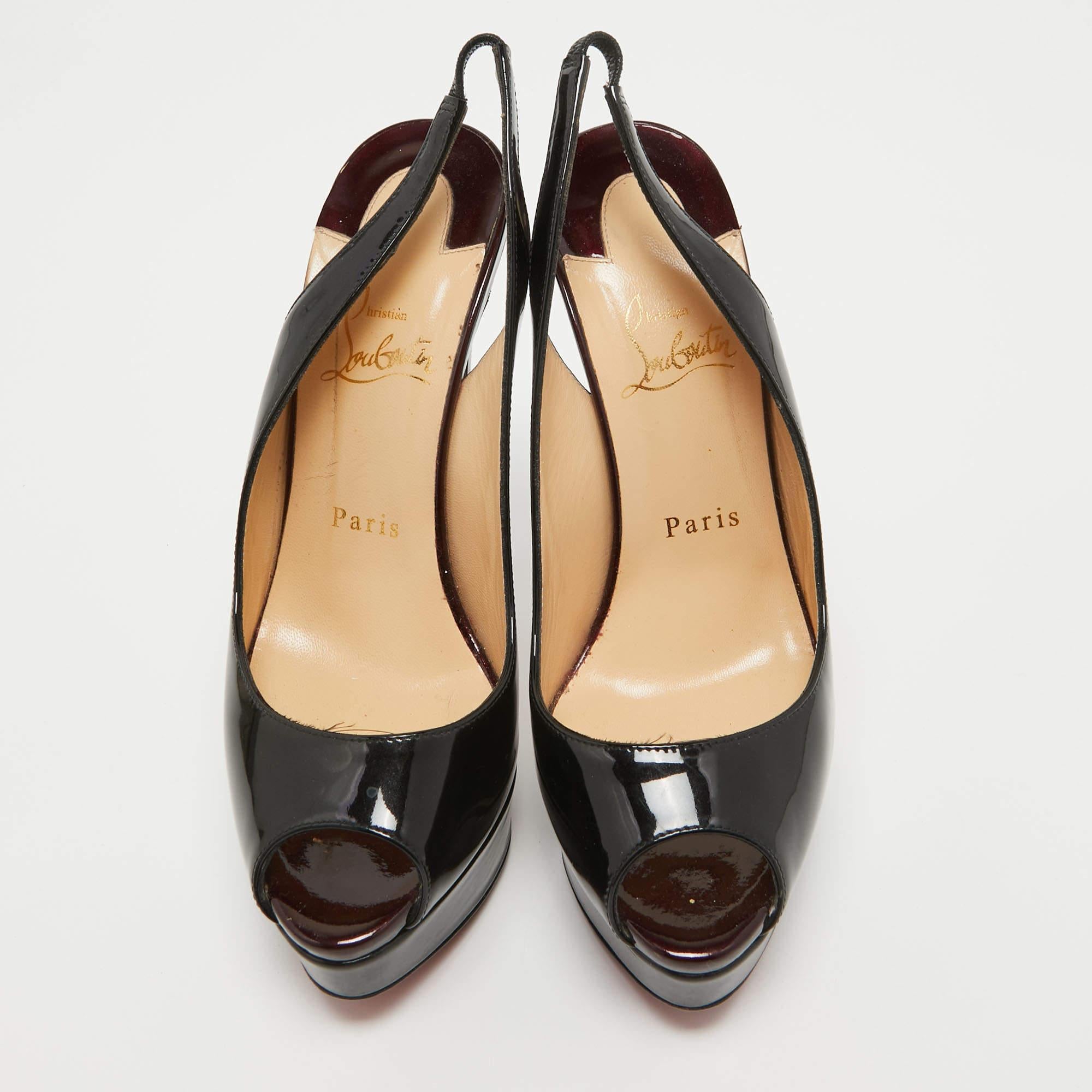 Stand out from the crowd with this luxurious pair of Louboutins that exude high fashion with class. Crafted from patent leather, this is a creation from their Lady Peep collection. It features a black shade with peep toes and an architectural shape.