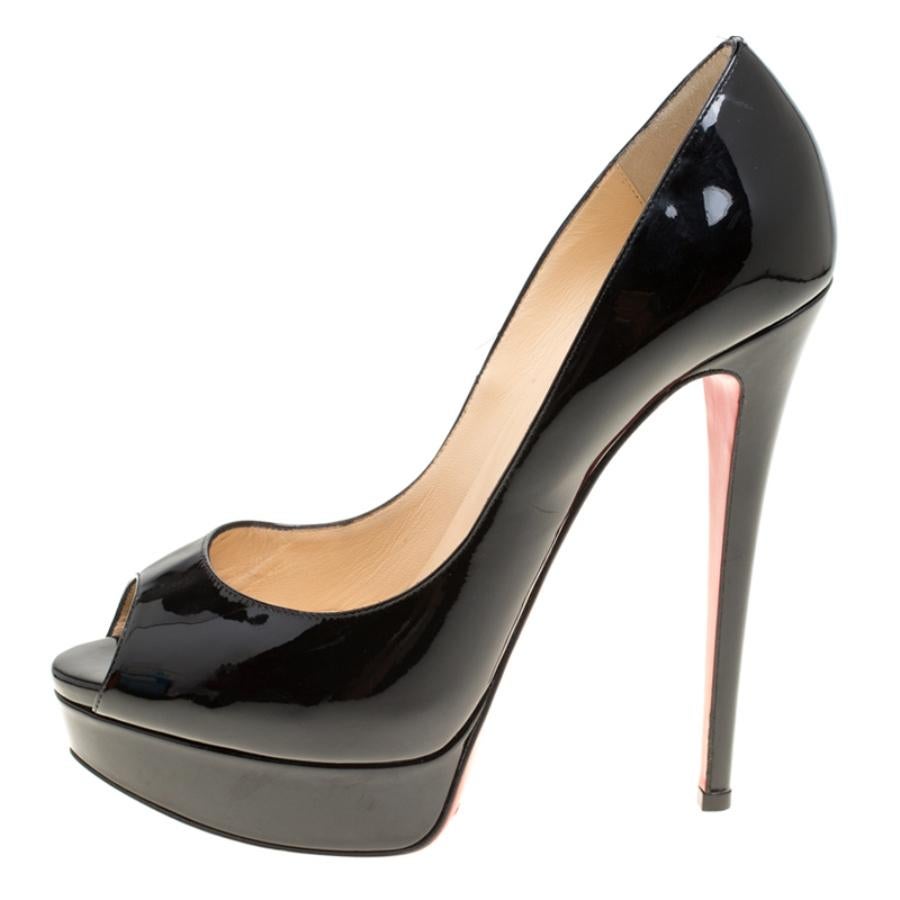 Stand out from a crowd with this gorgeous pair of Louboutins that exude high fashion with class! Crafted from patent leather, this is a creation from their Lady Peep collection. They feature a coating of black with peep toes and 15 heels supported