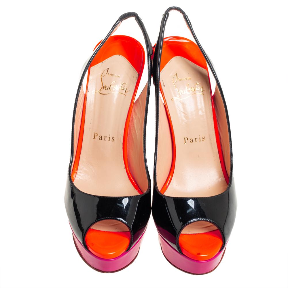 Stand out from the crowd with this gorgeous pair of Louboutins that exude high fashion with class! Crafted from patent leather, this is a creation from their Lady Peep collection. They feature a color block pattern with peep toes and a glossy