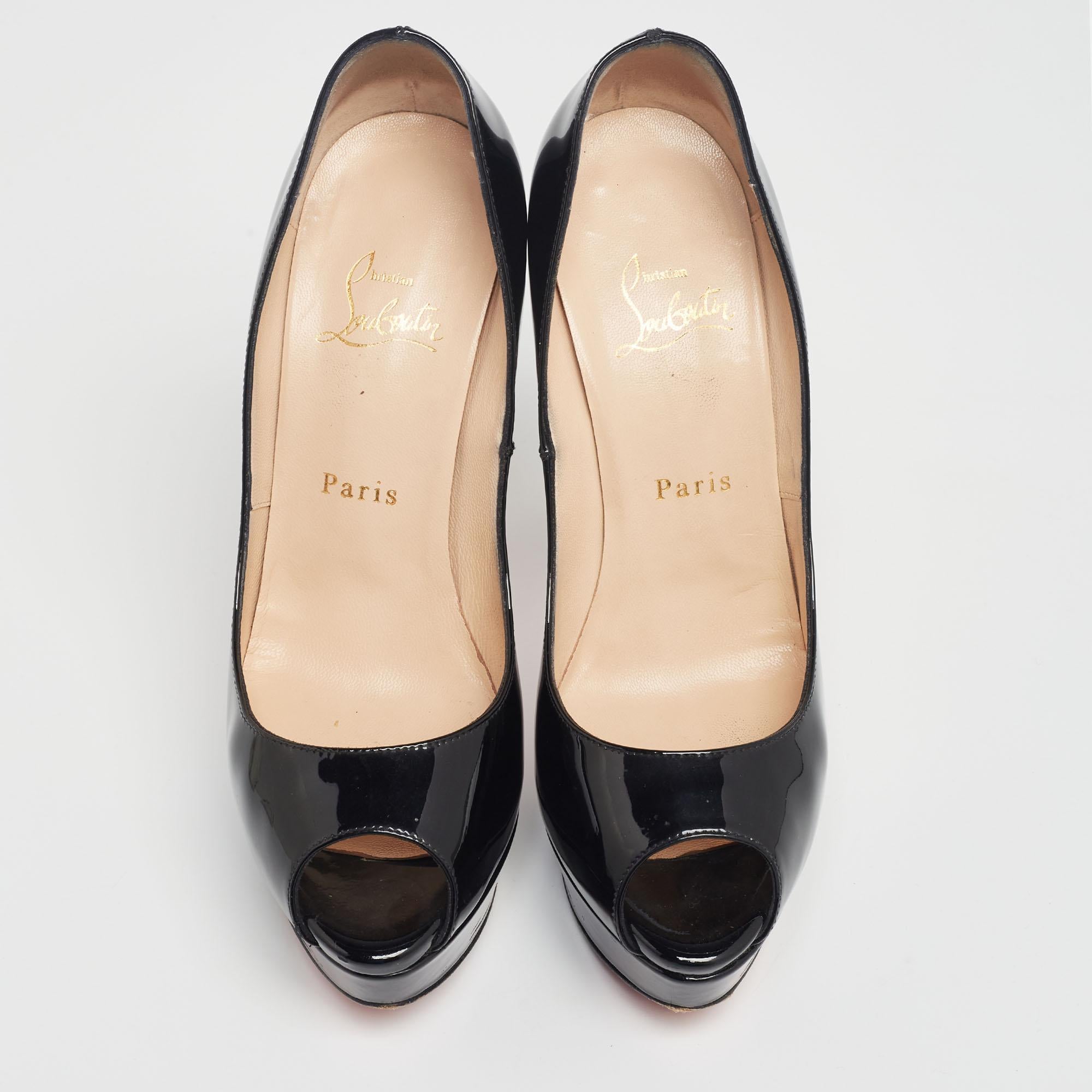 Stand out from the crowd with this gorgeous pair of Louboutins that exude high fashion with class! Crafted from patent leather, this is a creation from their Lady Peep collection. They feature a classic black shade with peep toes and a glossy