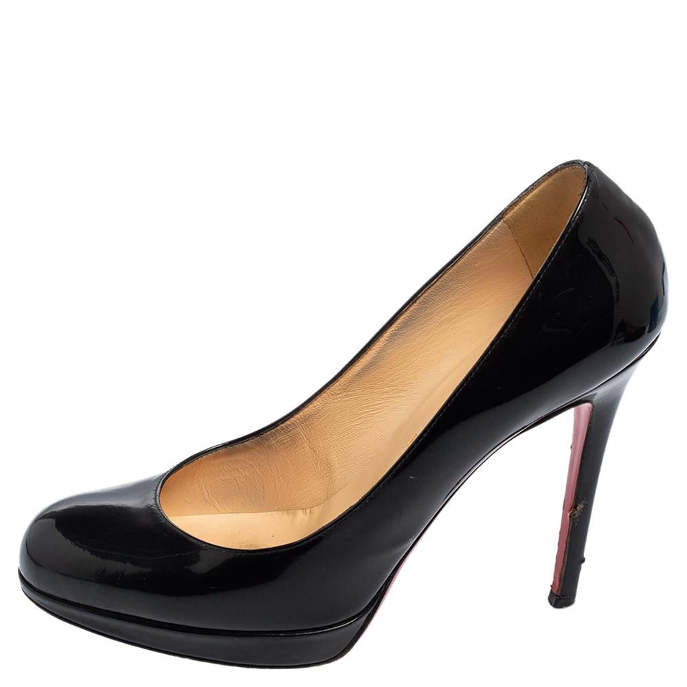 Escape the monotonous designs and move on to classy styles as these New Simple pumps from Christian Louboutin. They showcase a sleek silhouette crafted from black patent leather and are finished with rounded toes, platforms, and pointy heels. Feel