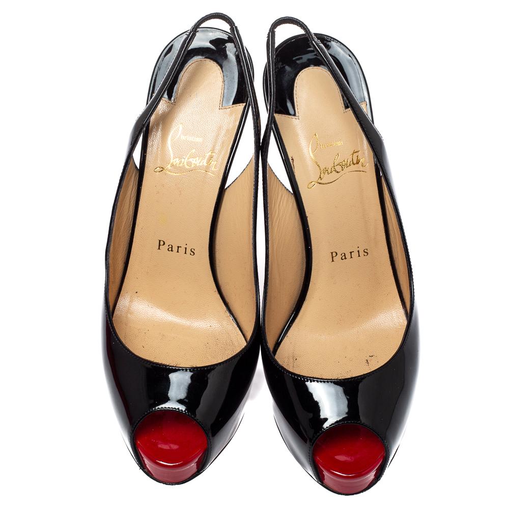 These Christian Louboutin Prive peep toe sandals have clear potential to uplift your spirits! These pumps are designed with patent black leather and showcase rounded peep toes and are equipped with elasticized slingback straps. Elevated on 12 cm