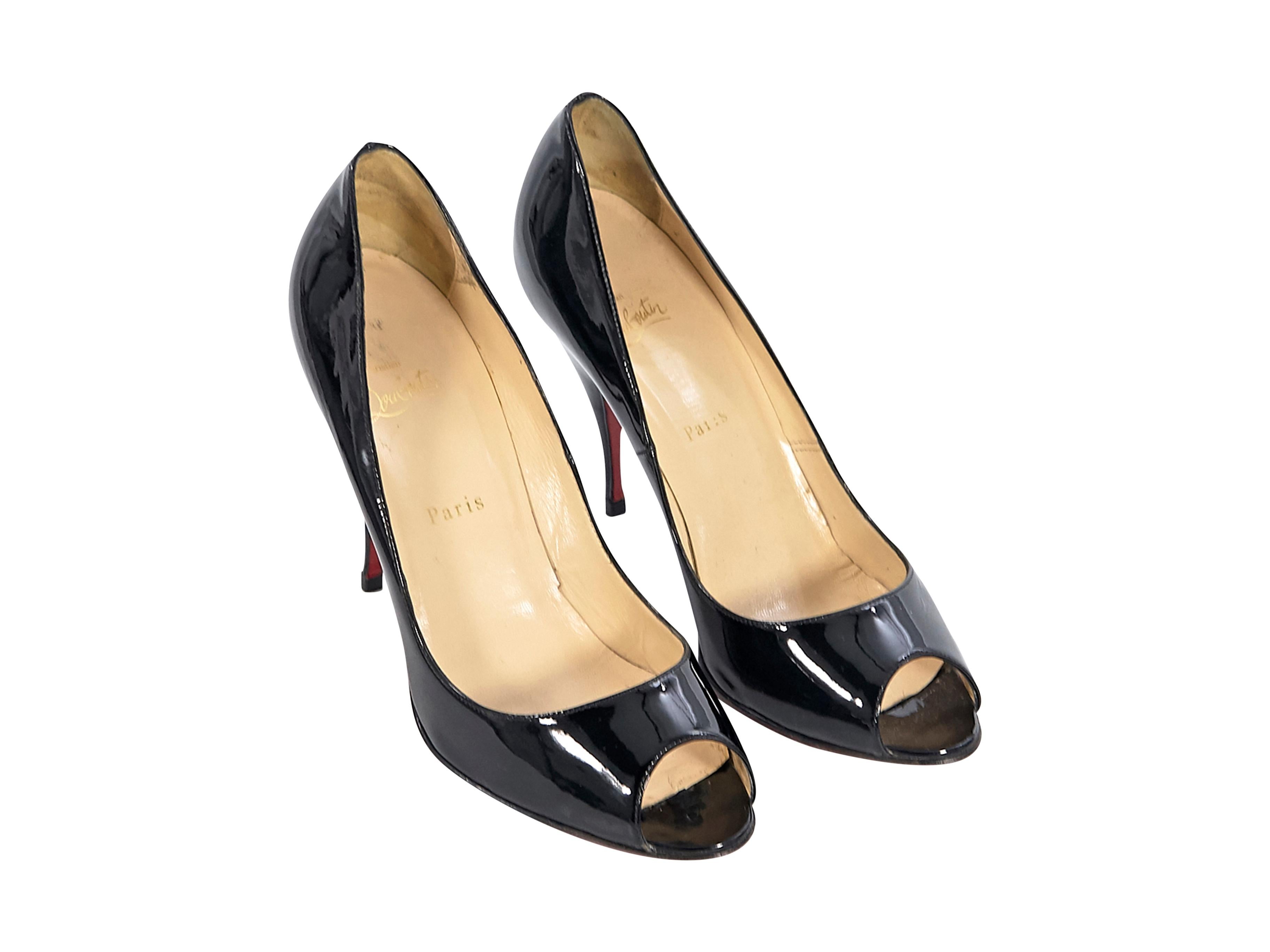 Product details:  Black patent leather pumps by Christian Louboutin.  Peep toe.  Iconic red sole.  Slip-on style.  4.5