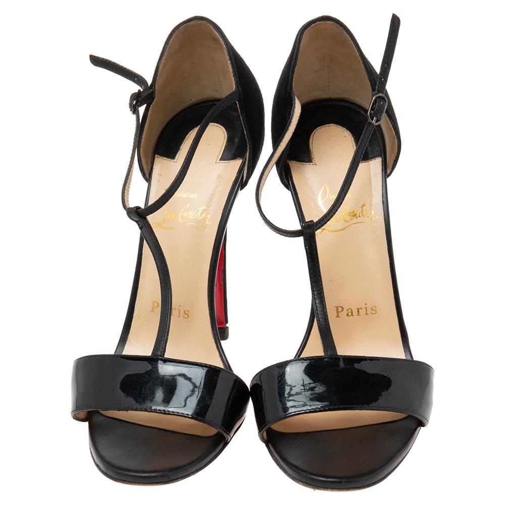 There are some shoes that stand the test of time and fashion cycles, these timeless Christian Louboutin sandals are the one. Crafted from suede and patent leather in a black shade, they are designed with sleek cuts, open-toes, and tall heels.

