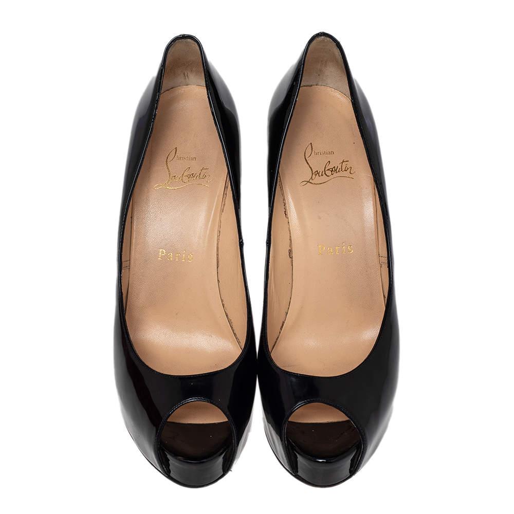 These stunning Christian Louboutin Miss Desprez peep-toe pumps bring a glamorous twist on the classic black shoe. Constructed in black patent leather, these pumps feature a platform at the front along with a sleek silver-tone, chain-trimmed heel