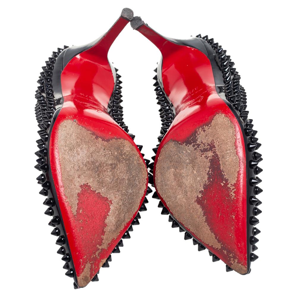 Dazzle everyone with these Louboutins by owning them today. Crafted from patent leather, these black Pigalle pumps carry a mesmerizing shape with pointed toes and 10 cm heels. Complete with the signature red soles and spikes all over, this pair