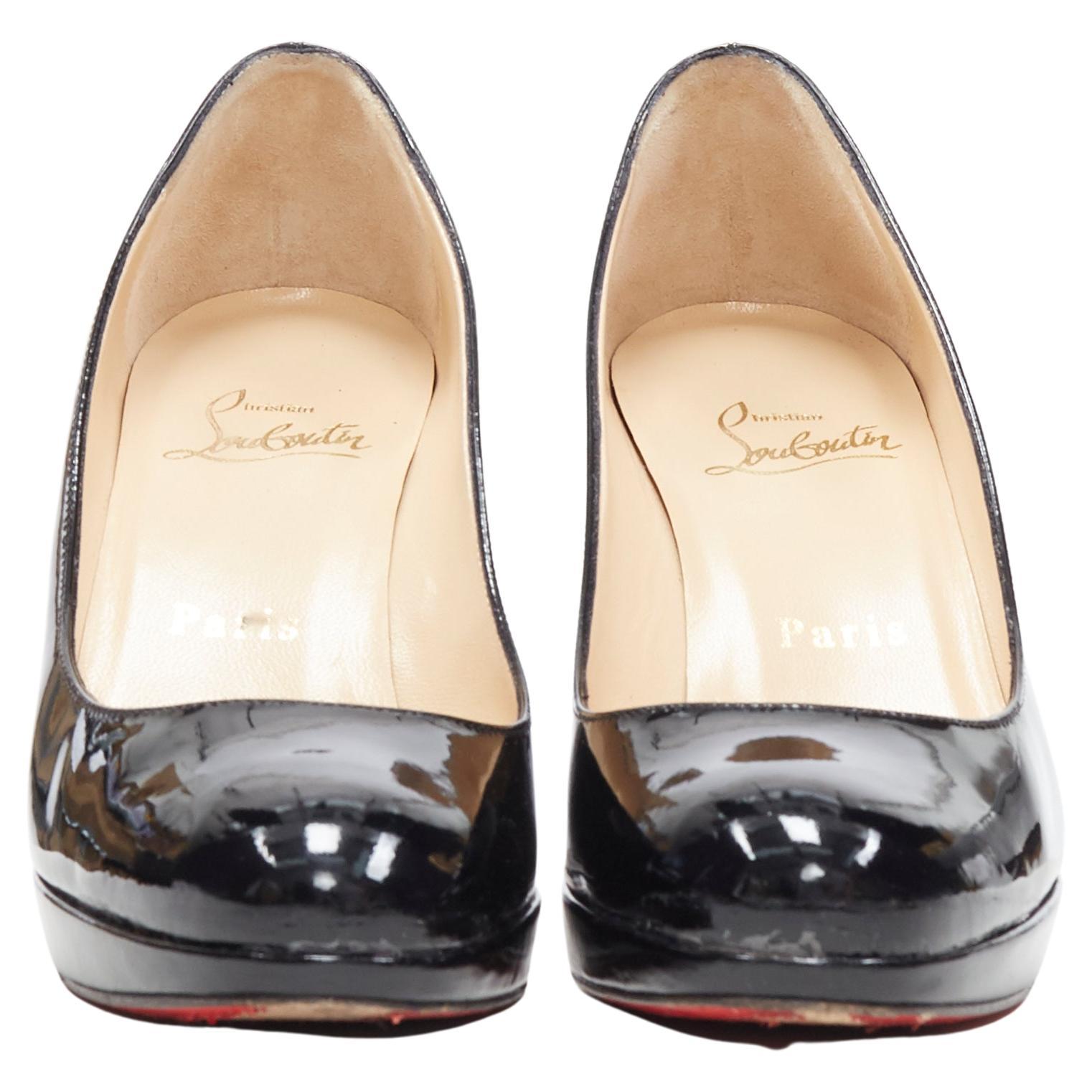 CHRISTIAN LOUBOUTIN black patent platform round toe high heel pump EU36
Brand: Christian Louboutin
Model: Platform pump
Material: Leather
Color: Black
Pattern: Solid
Made in: Italy

CONDITION:
Condition: Good, this item was pre-owned and is in good