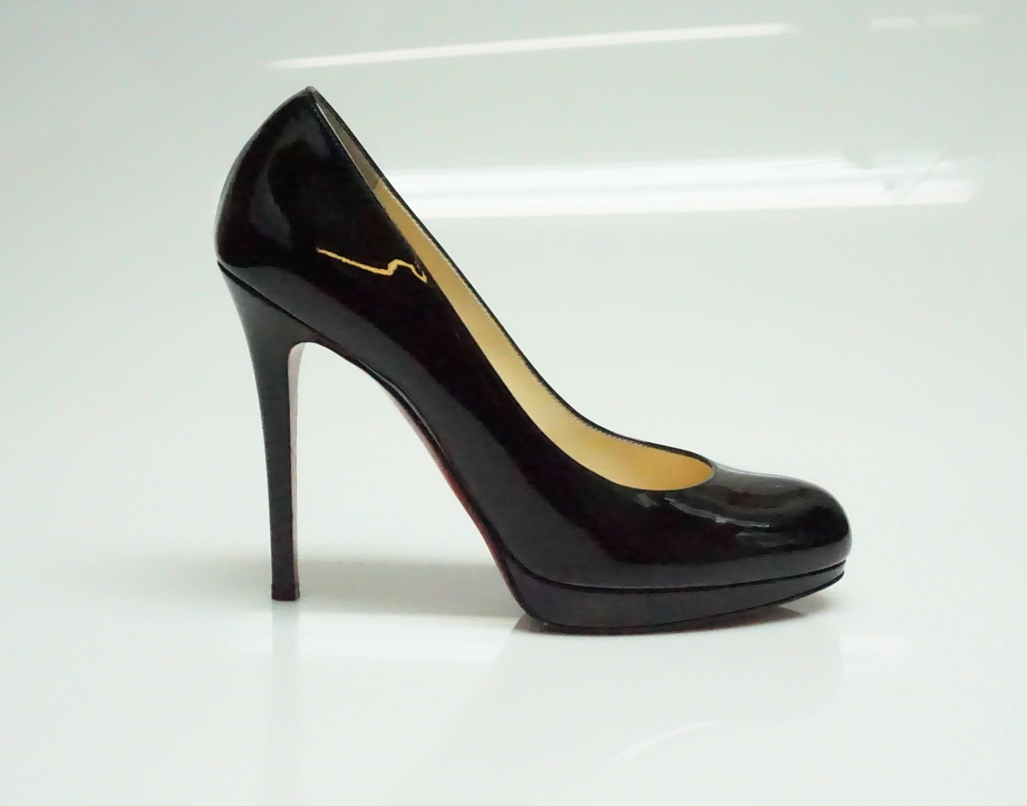 Christian Louboutin Black Patent Pumps - 37  These classic Louboutin pumps are in excellent condition. The bottom of the show has some wear and there are a few scuff marks on the toe of the shoe. 
Heel height: 4.5