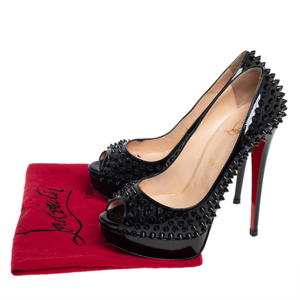 Stand out from the crowd with this gorgeous pair of Louboutins that exude high fashion with class! Crafted from patent leather, this is a creation from their Lady Peep collection. They feature a classic black shade with spike embellishments all over