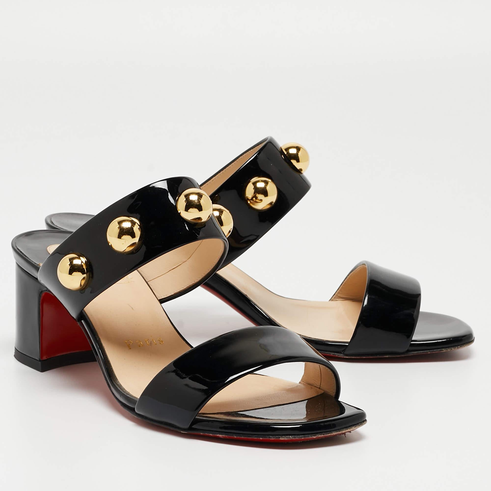 Louboutins are designed to lift one's attitude and outfit. Let this pair lift yours as well by owning them today. Crafted from patent leather, these black sandals feature an open-toe silhouette and studded vamp straps. They are completed with 5cm